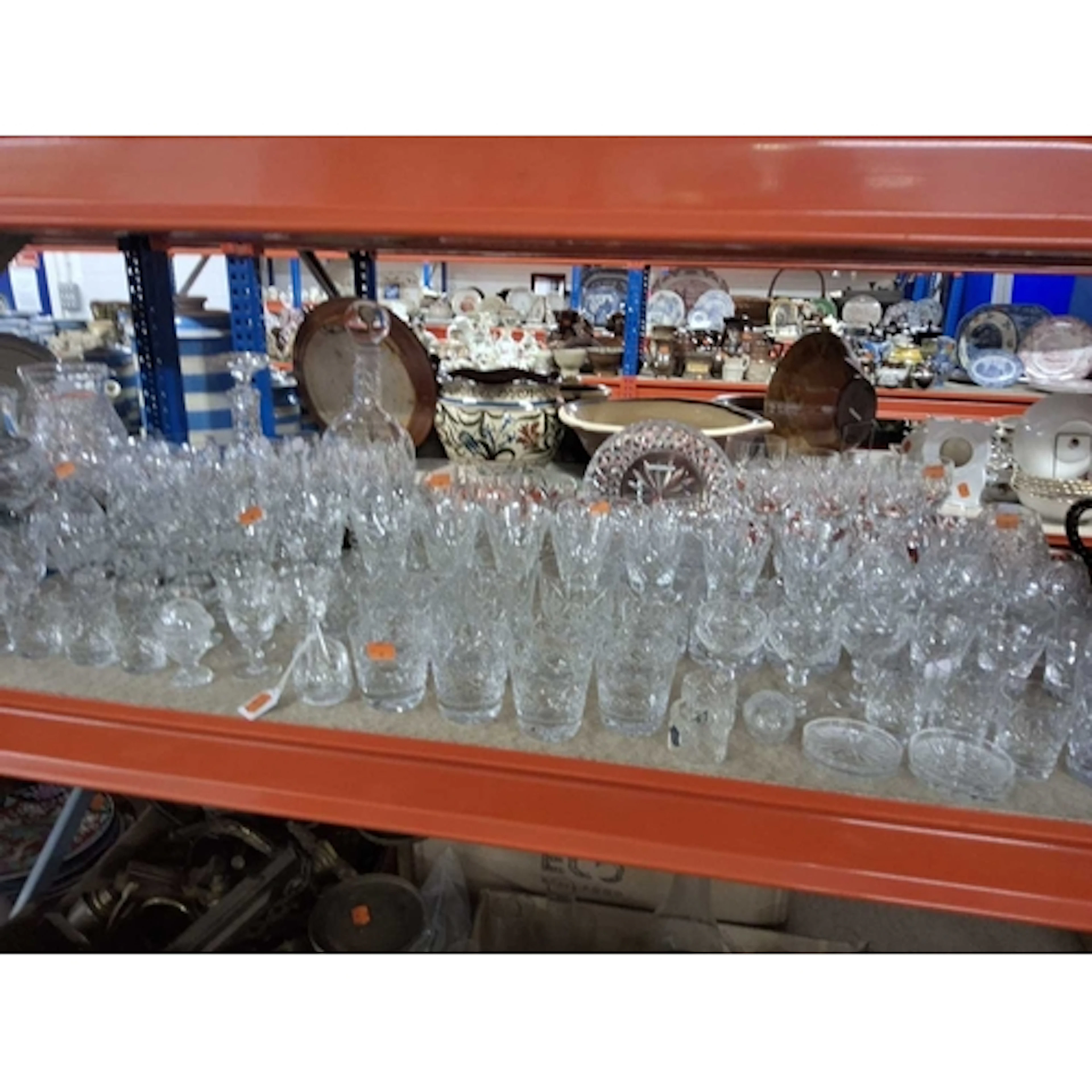 A LARGE QUANTITY OF MOSTLY CUT GLASS AND CRYSTAL DRINKING VE...