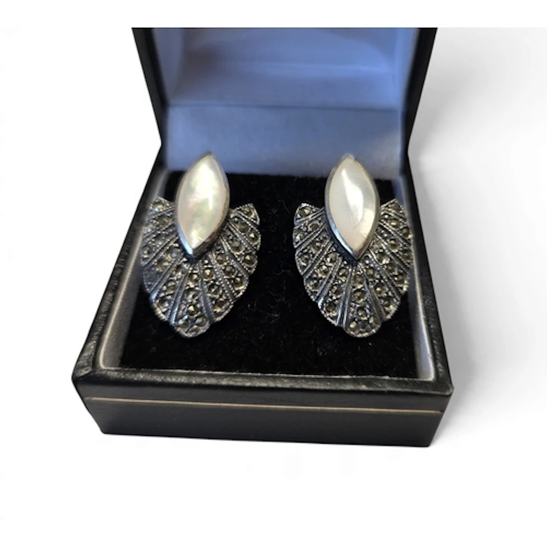 A good pair of Silver and mother-of-pearl earrings in the Ar...