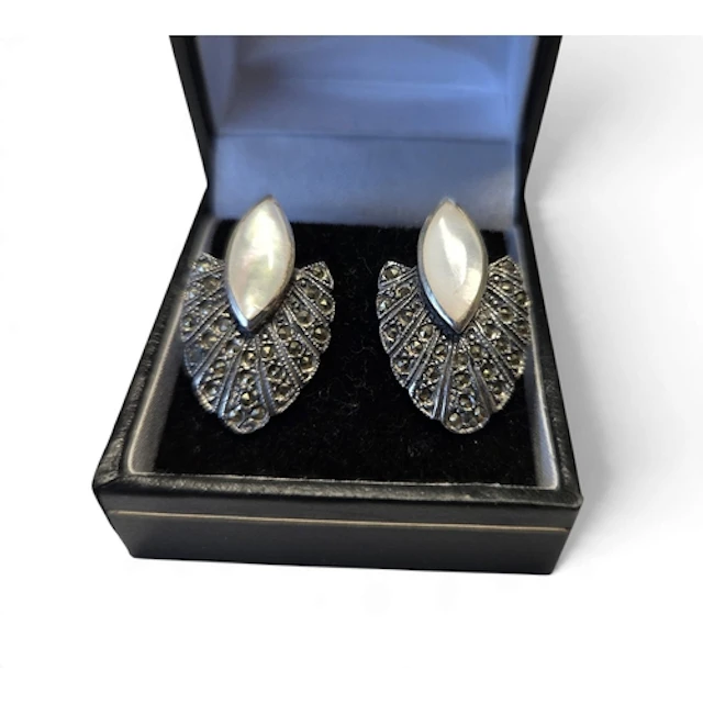A good pair of Silver and mother-of-pearl earrings in the Ar...