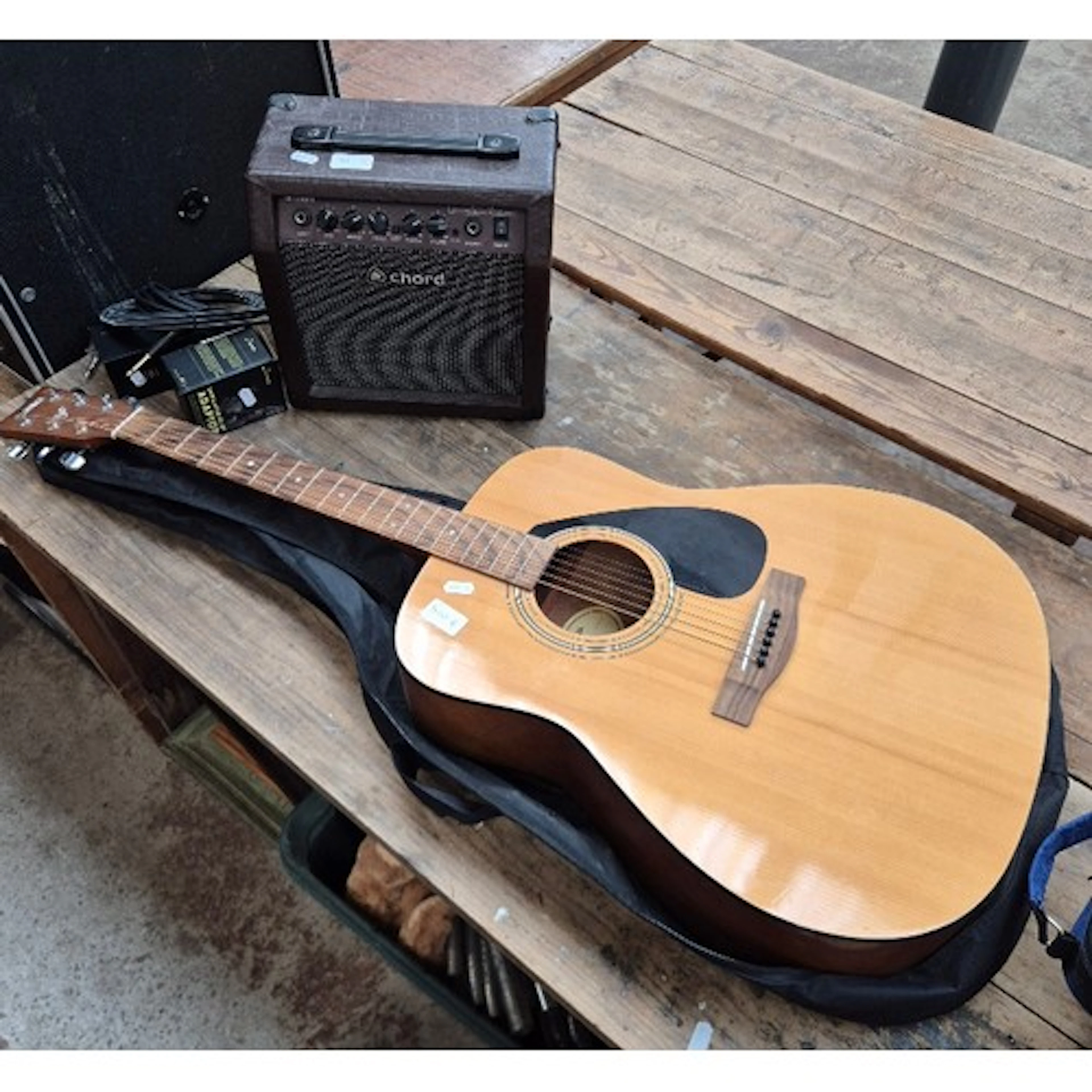 A Fender F310 steel strung acoustic guitar, Chord amplifier ...