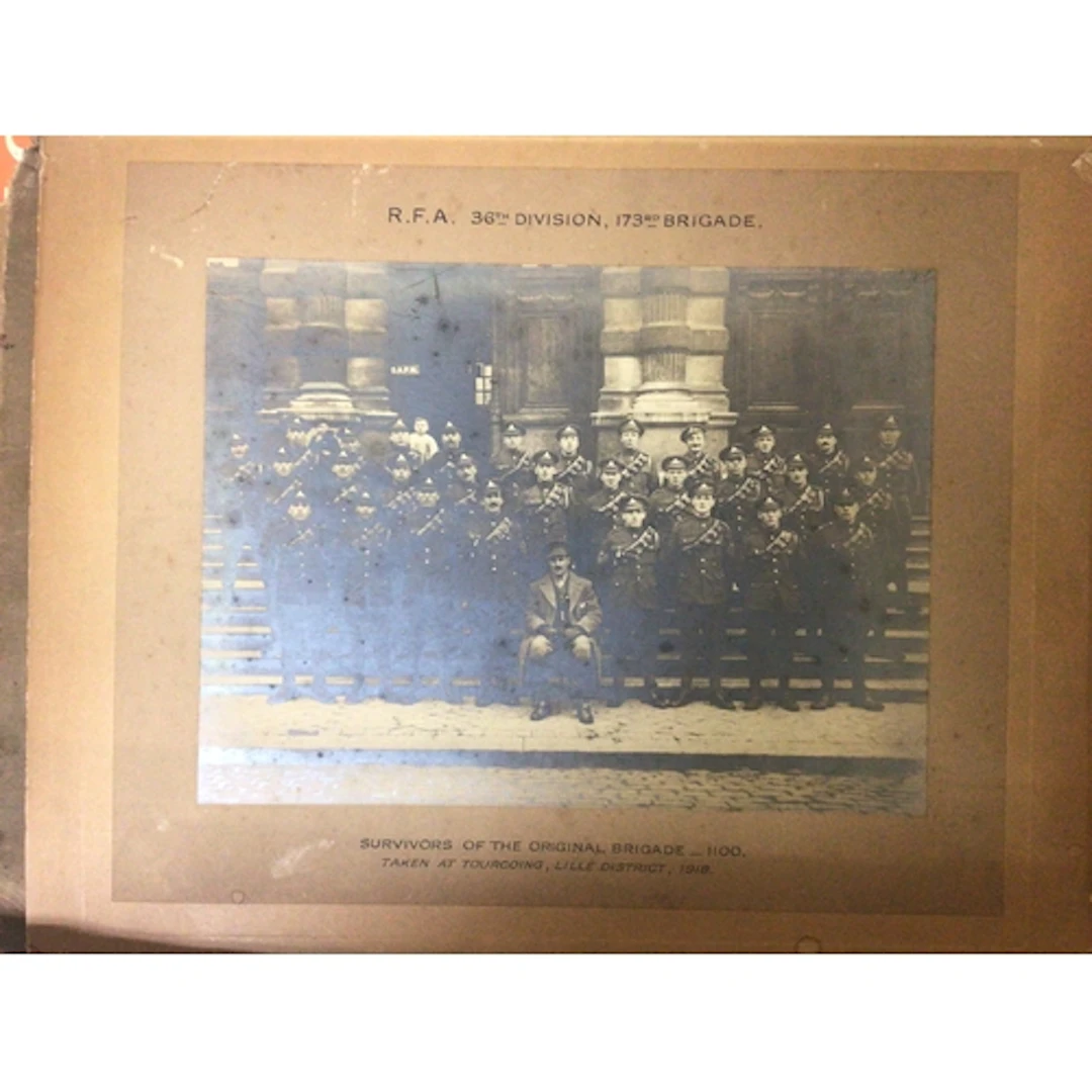 A box containing regimental group photos I world war and oth...