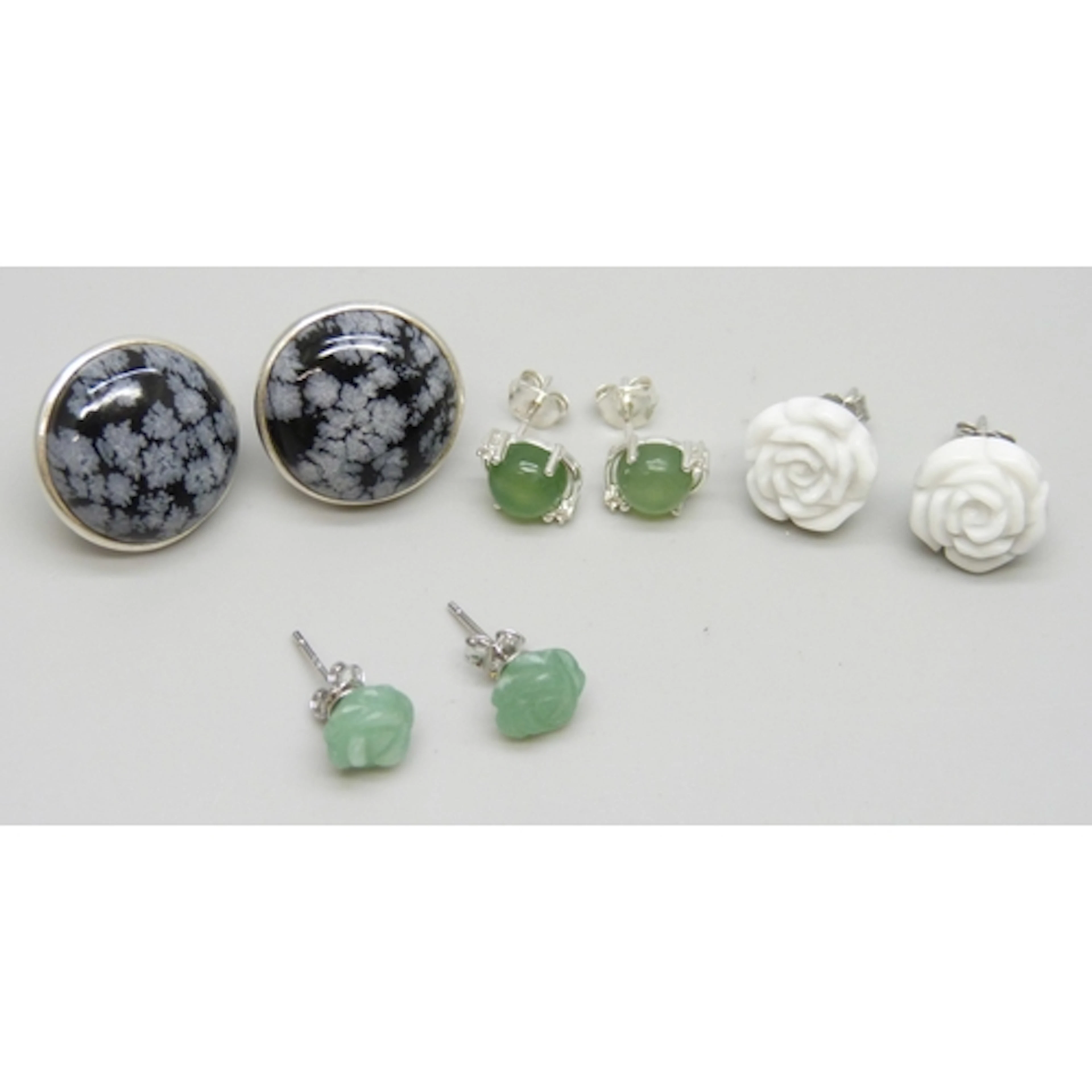 Four pairs of silver stud earrings including 2.87ct serpenti...