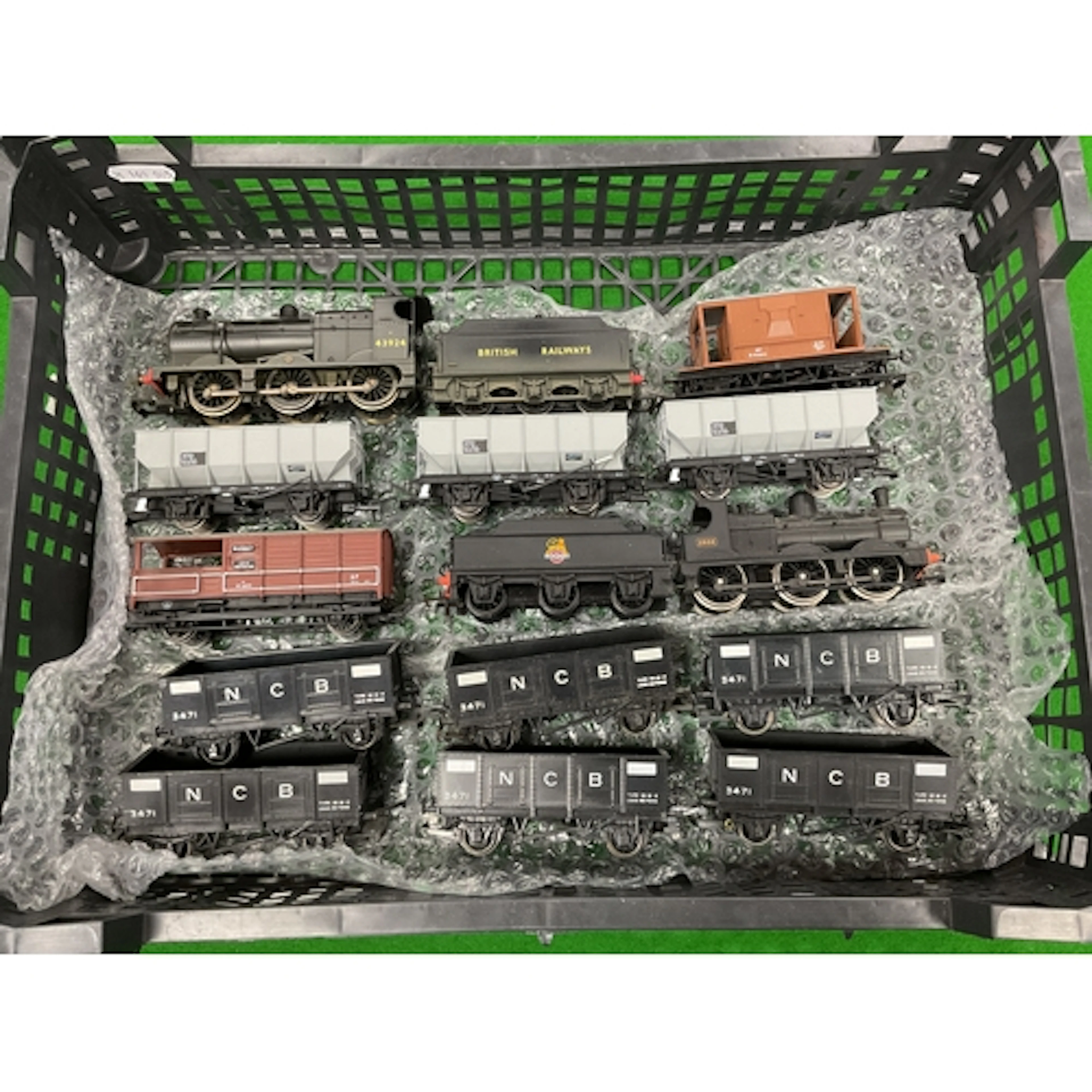 Two 00 gauge coal trains: a Hornby 4F 0-6-0, brake van and t...
