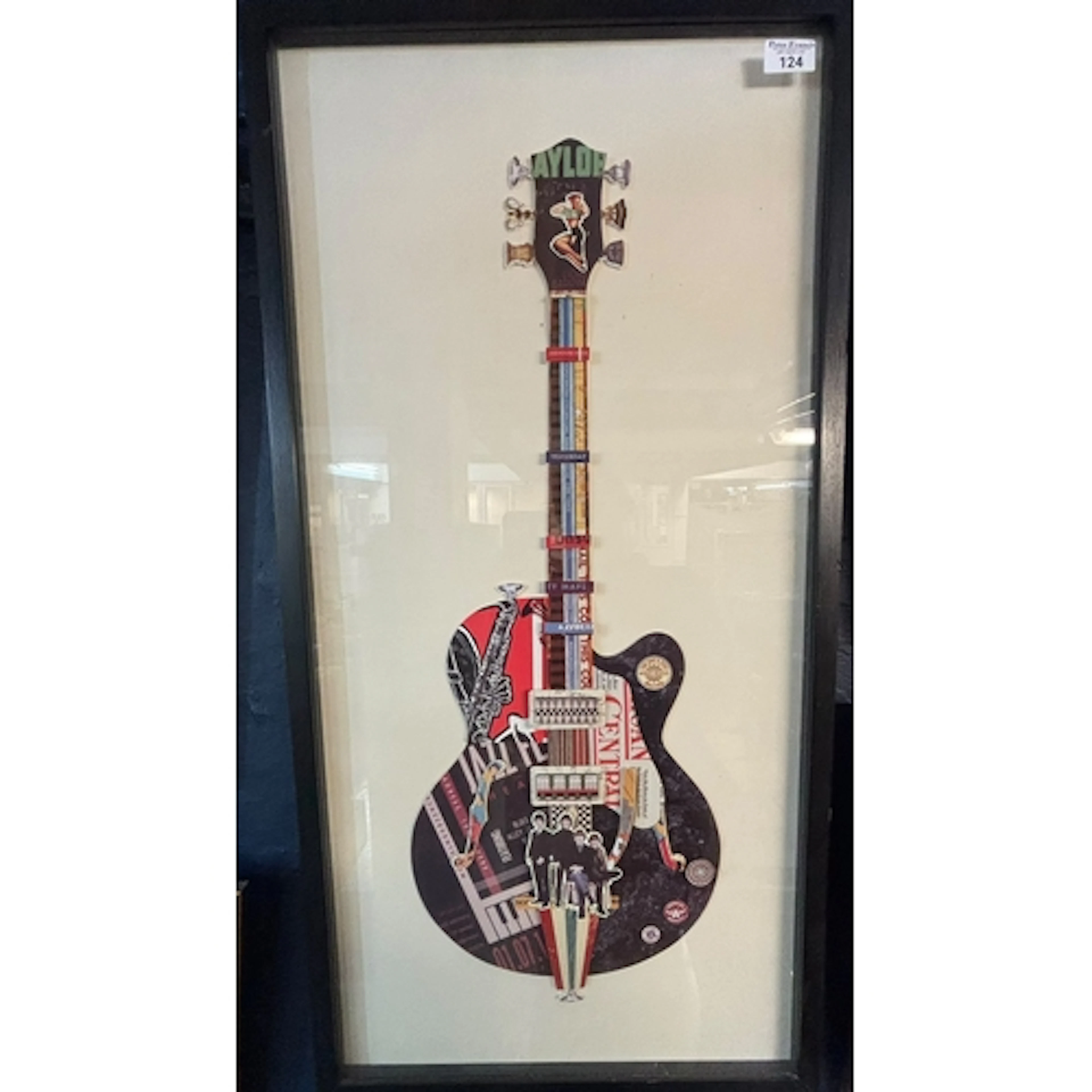 Framed guitar shaped Beatles themed printed collage. 88x42cm...