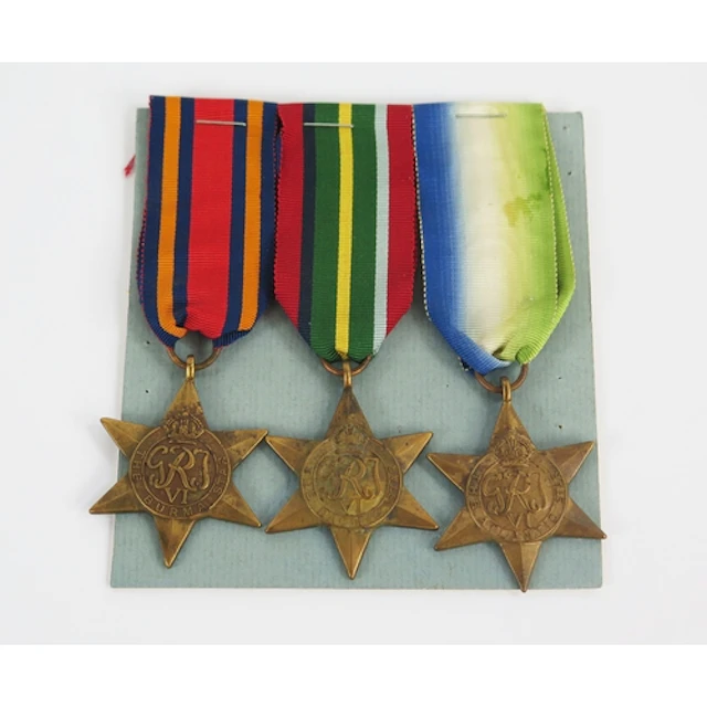 Three WWII stars, including Burma Star, Pacific Star and Atl...