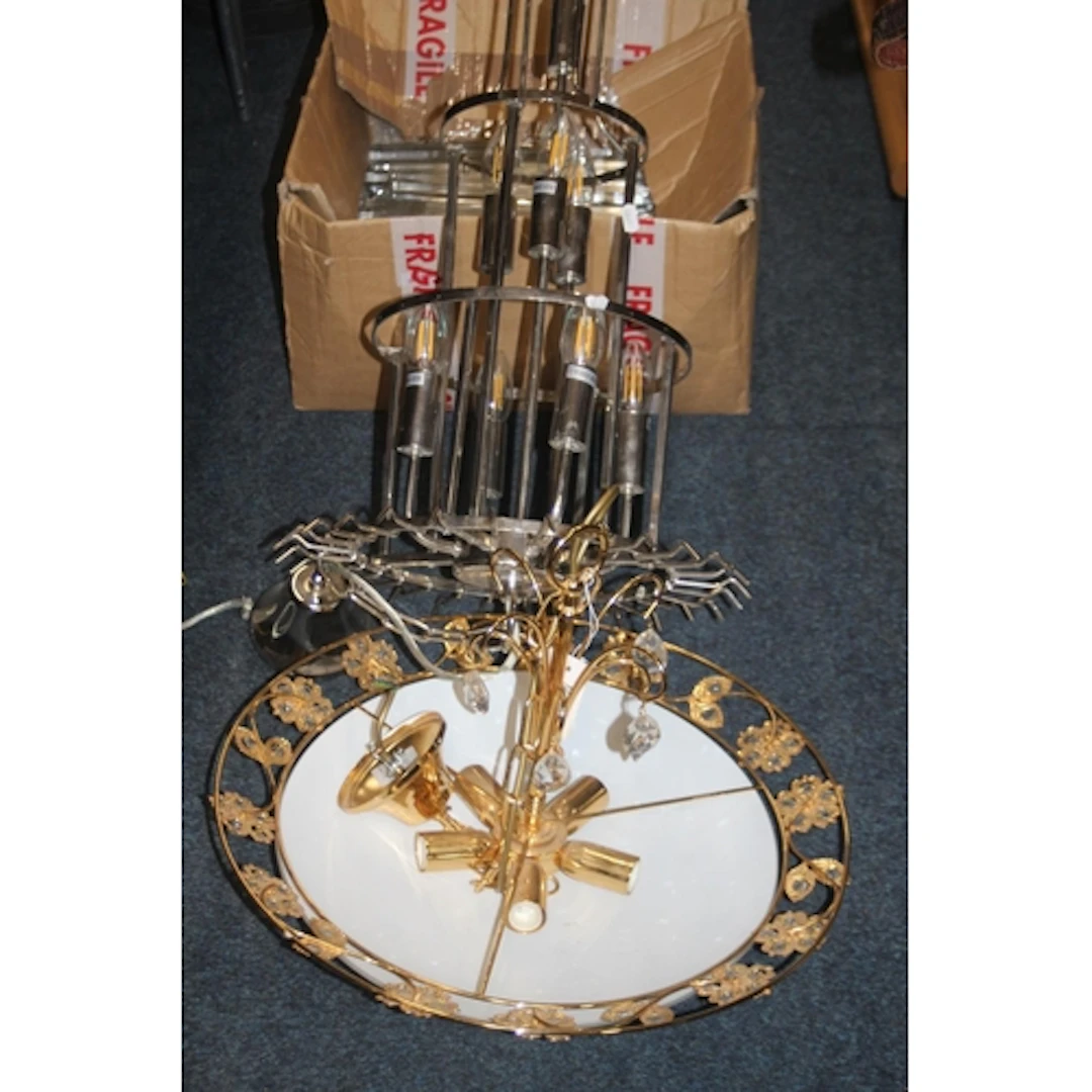 Chandelier with glass droplets and another hanging light.