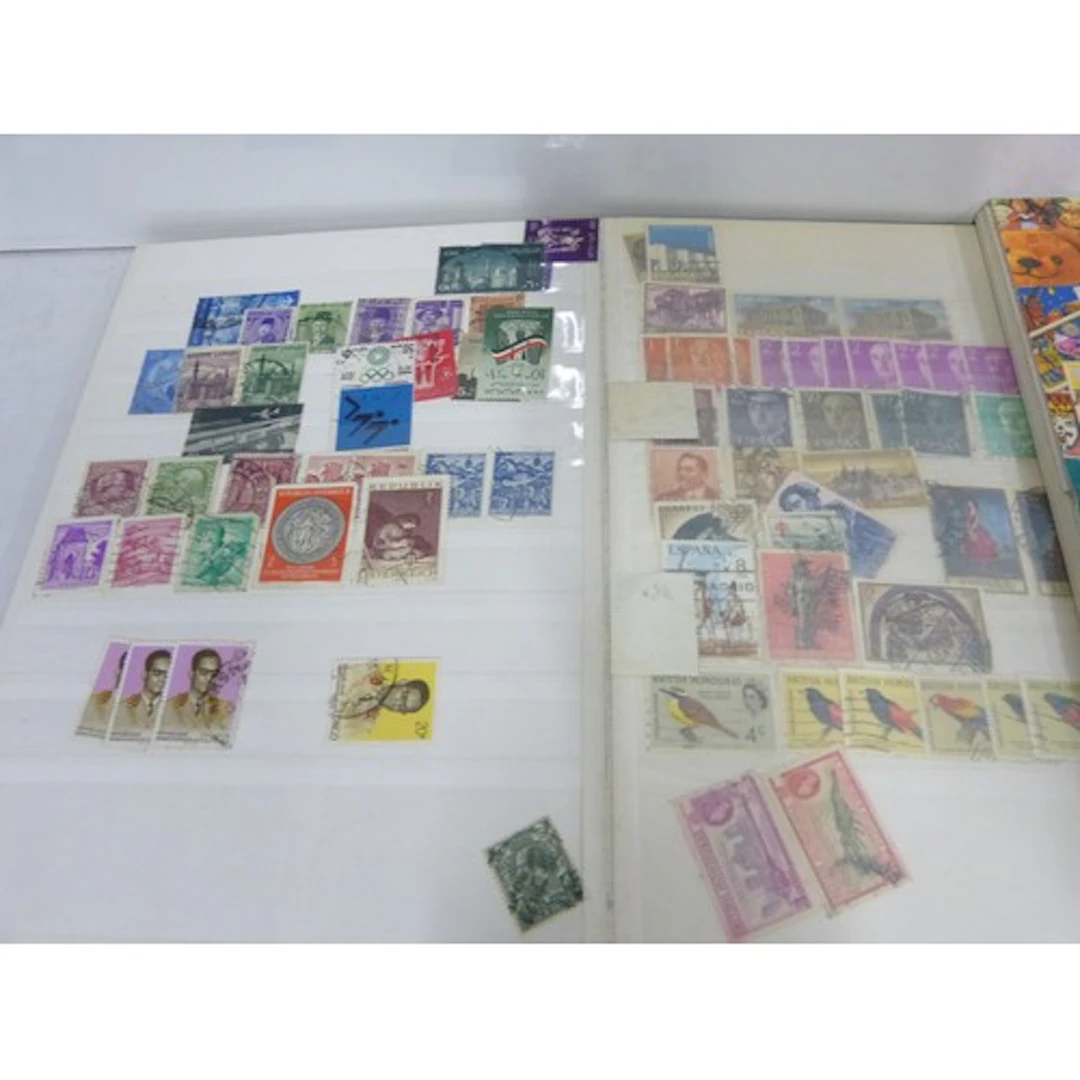 Two vintage World stamp albums.