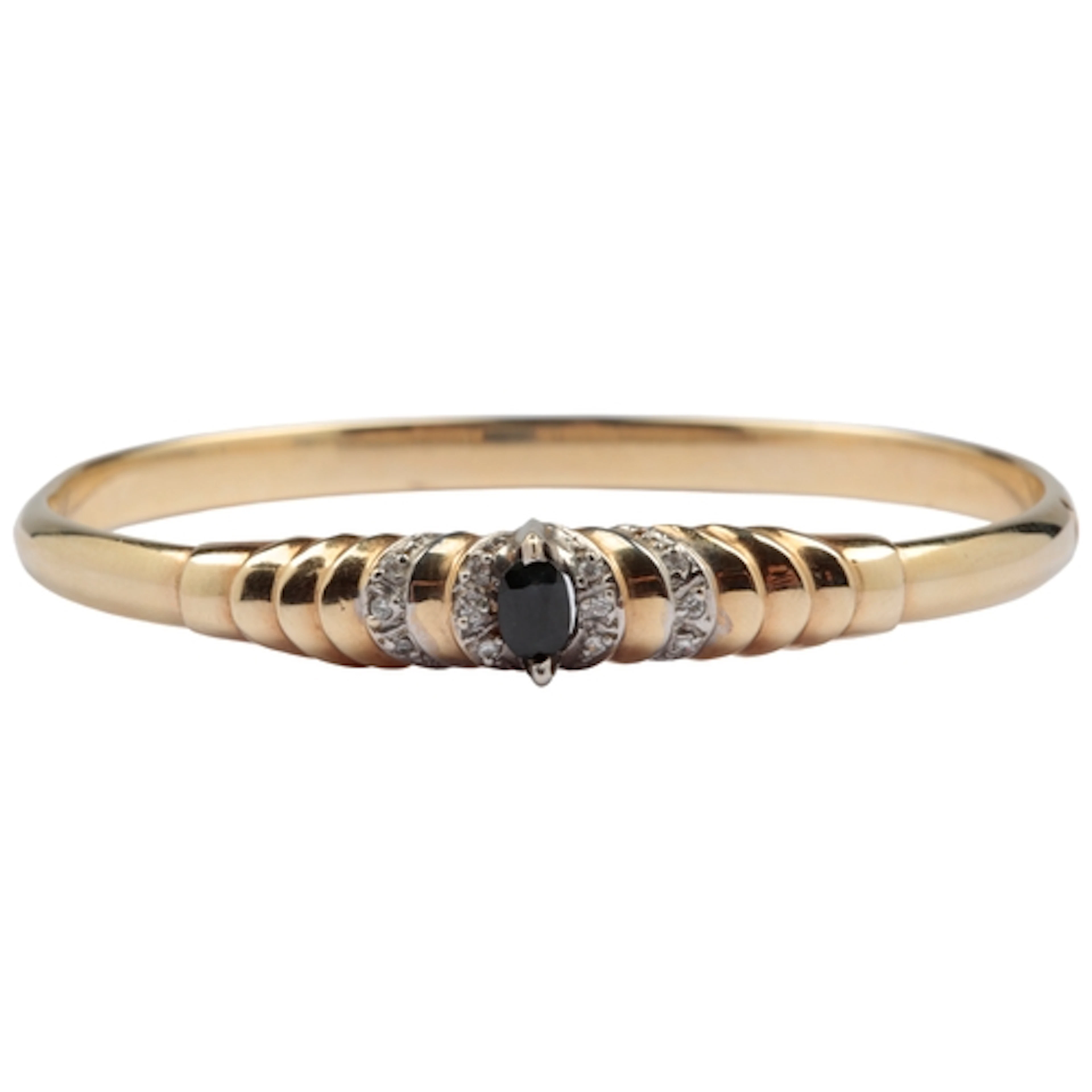 A sapphire bangle, the hinged bangle centring to the front o...