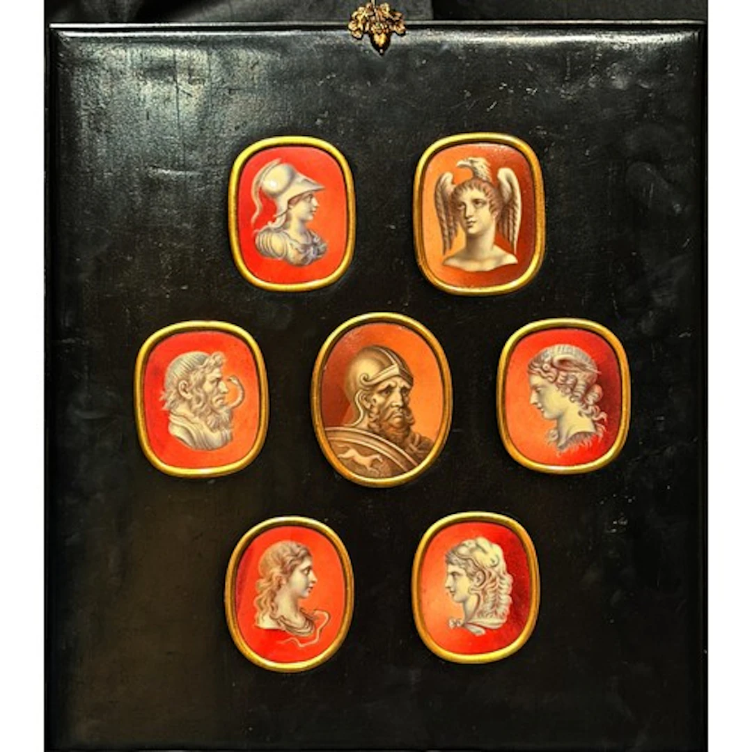 A framed group of seven miniatures of documented gems, attri...