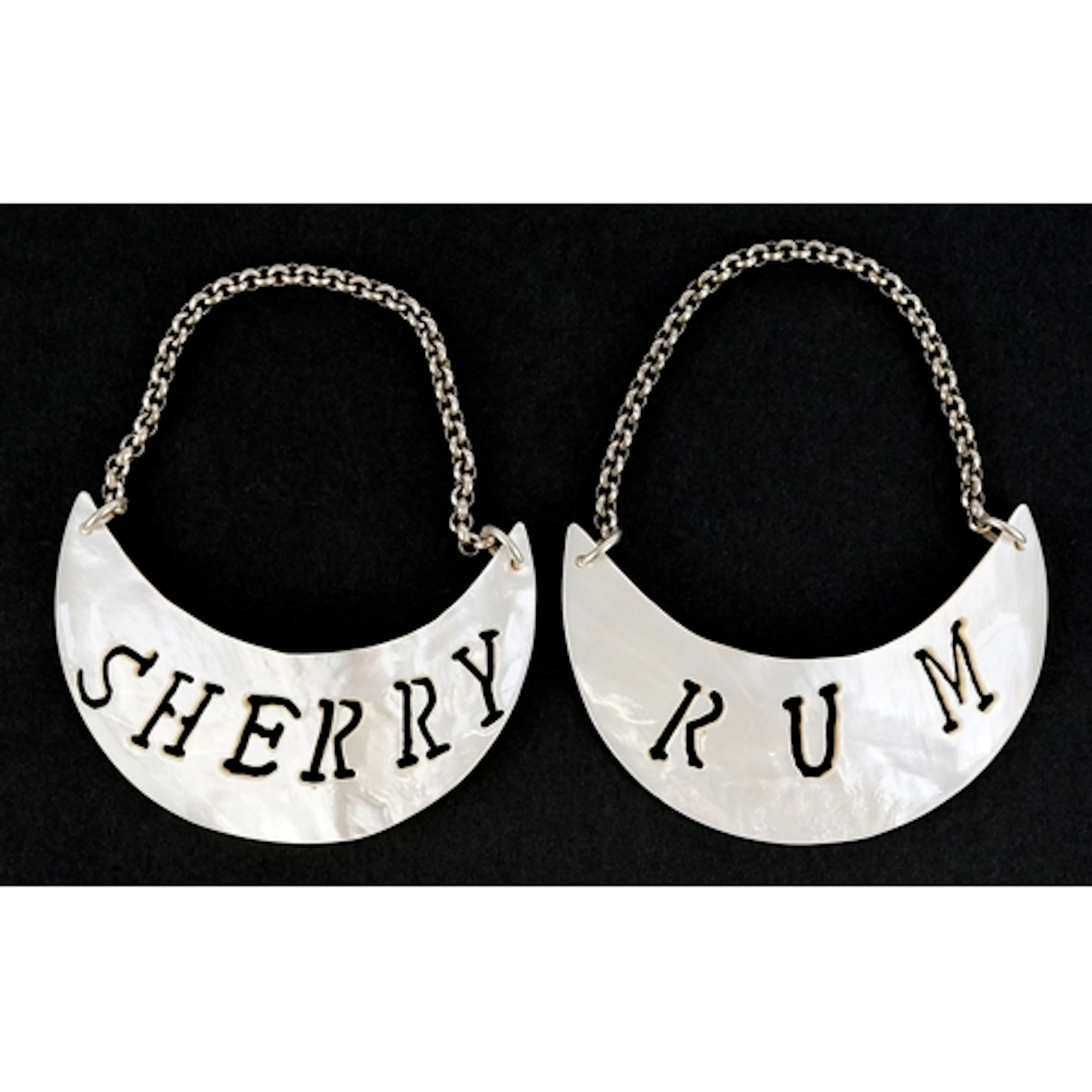 Two mother of pearl sherry and rum decanter labels, 7cm wide...