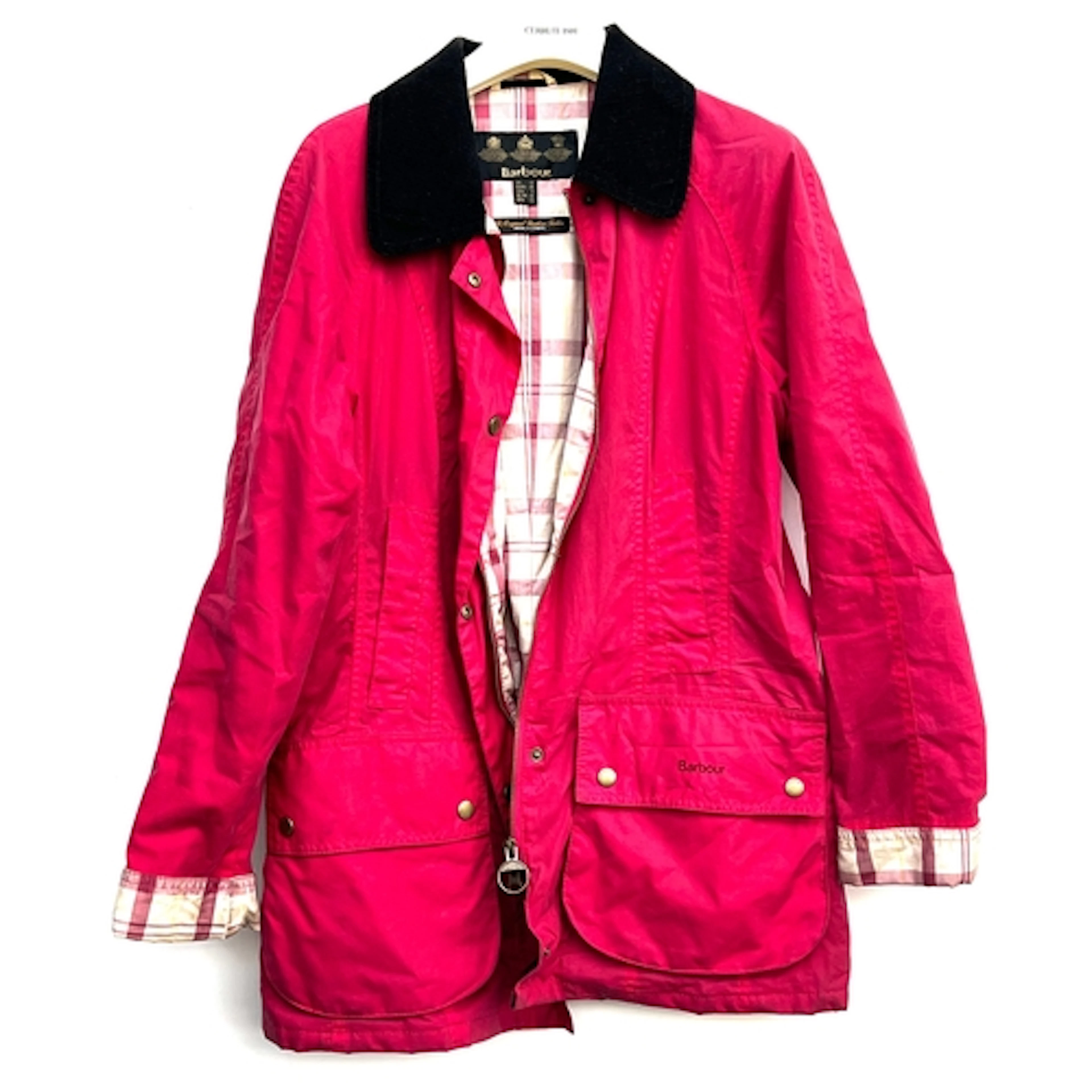 A ladies Barbour jacket, in a raspberry red/pink colour with...