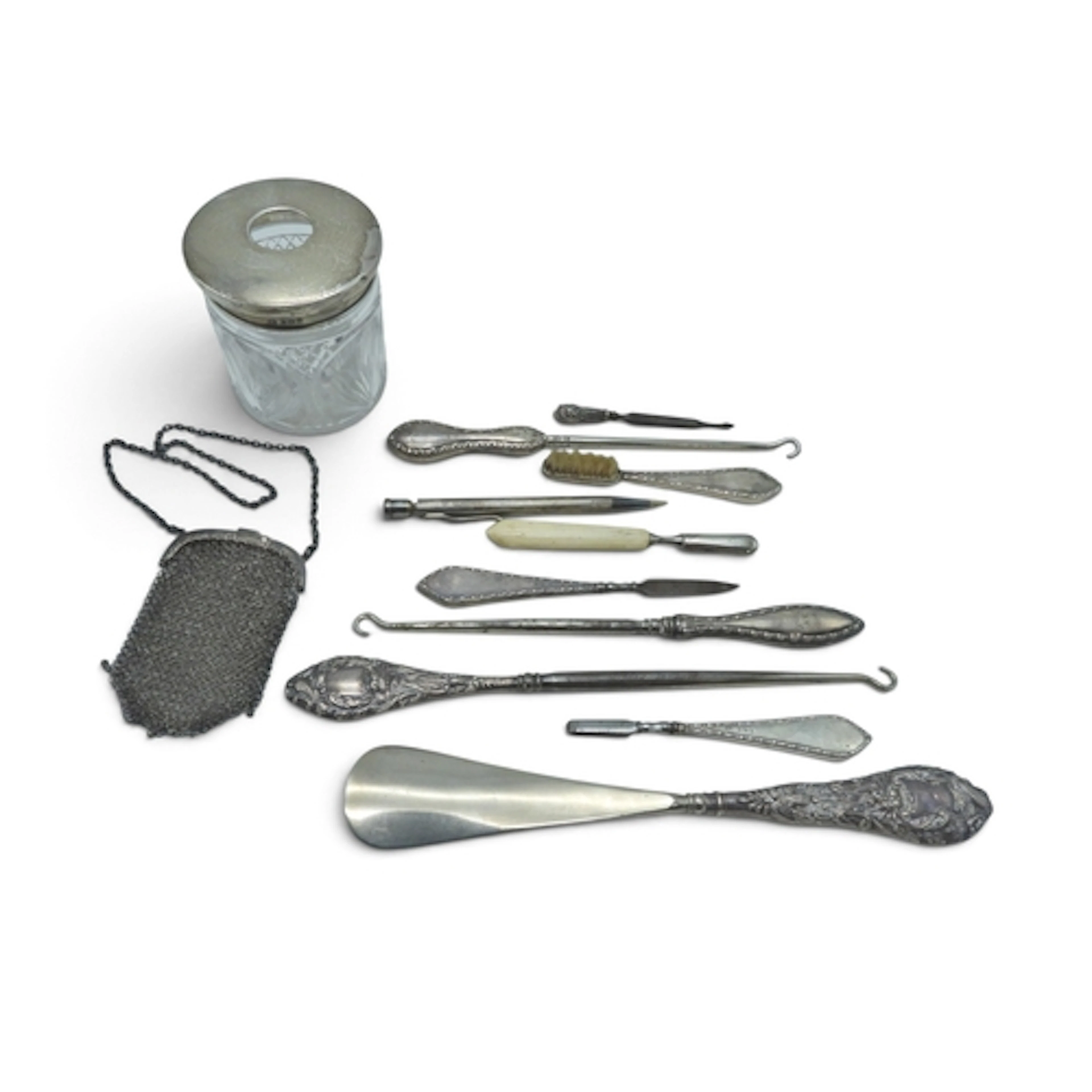 Three silver mounted boot hooks, a silver mounted shoe horn,...