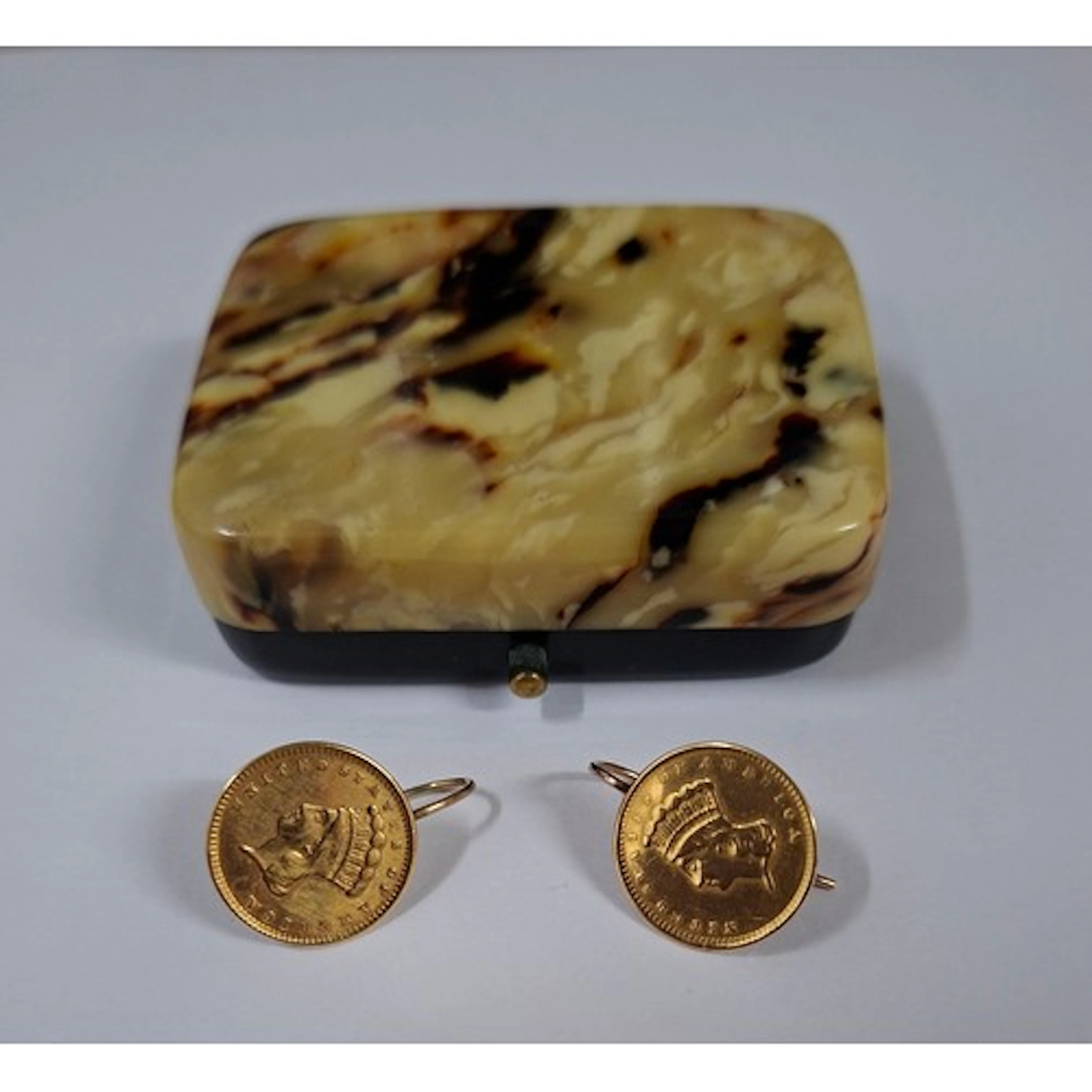 A pair of yellow metal coin earrings, the coins being 1850's...