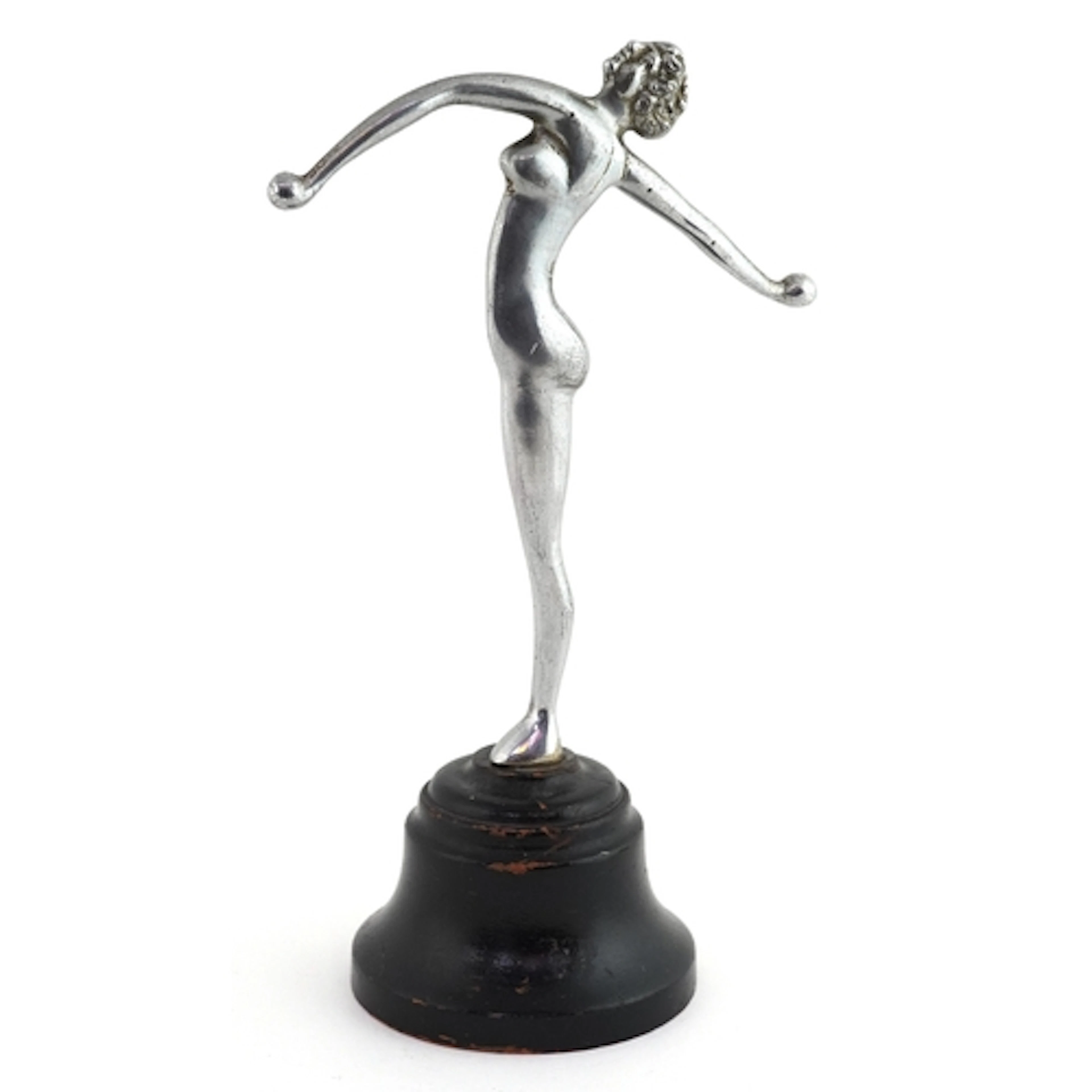 Chrome Art Deco figure of a nude female with raised arms, ra...