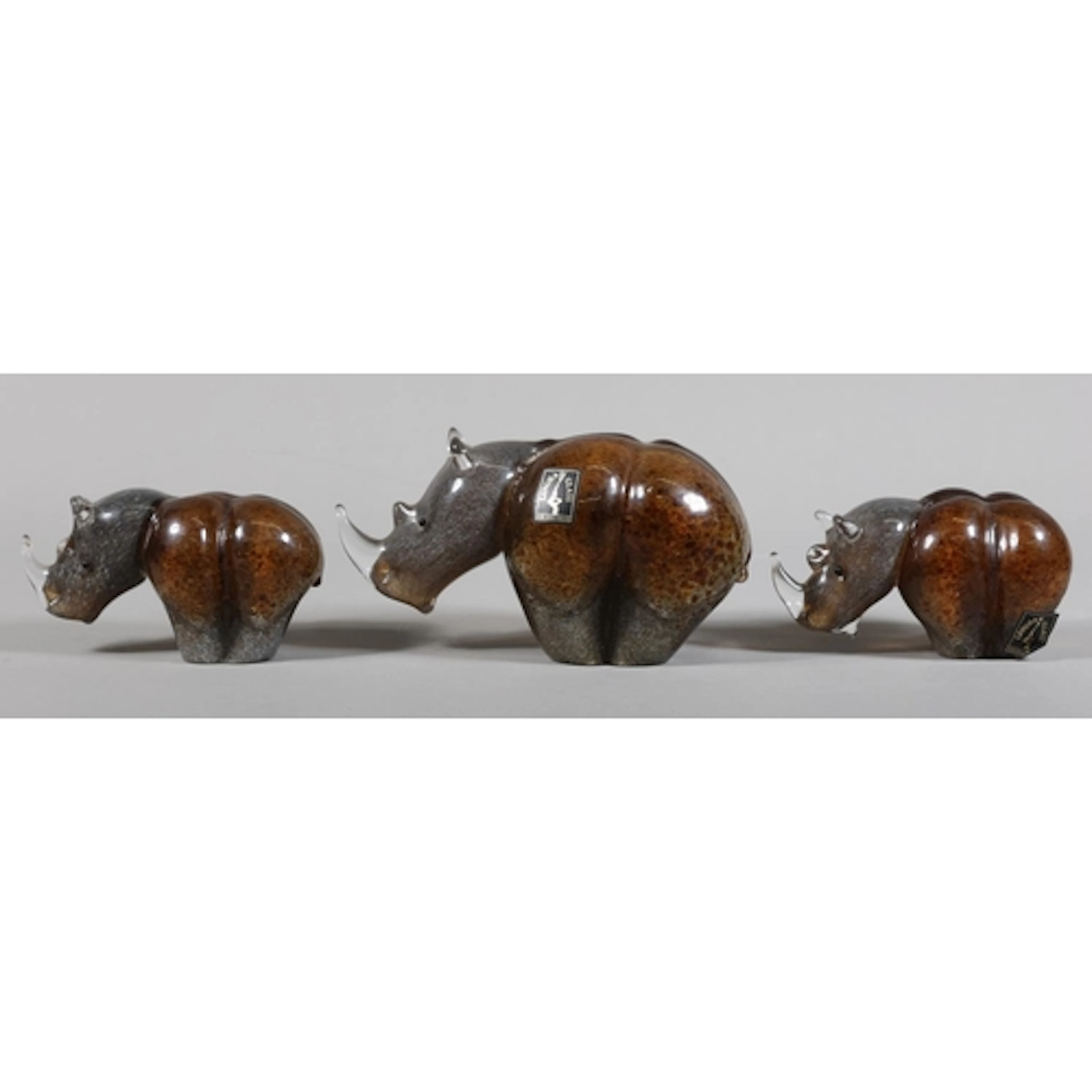 Three Langholm Glass rhinos.
