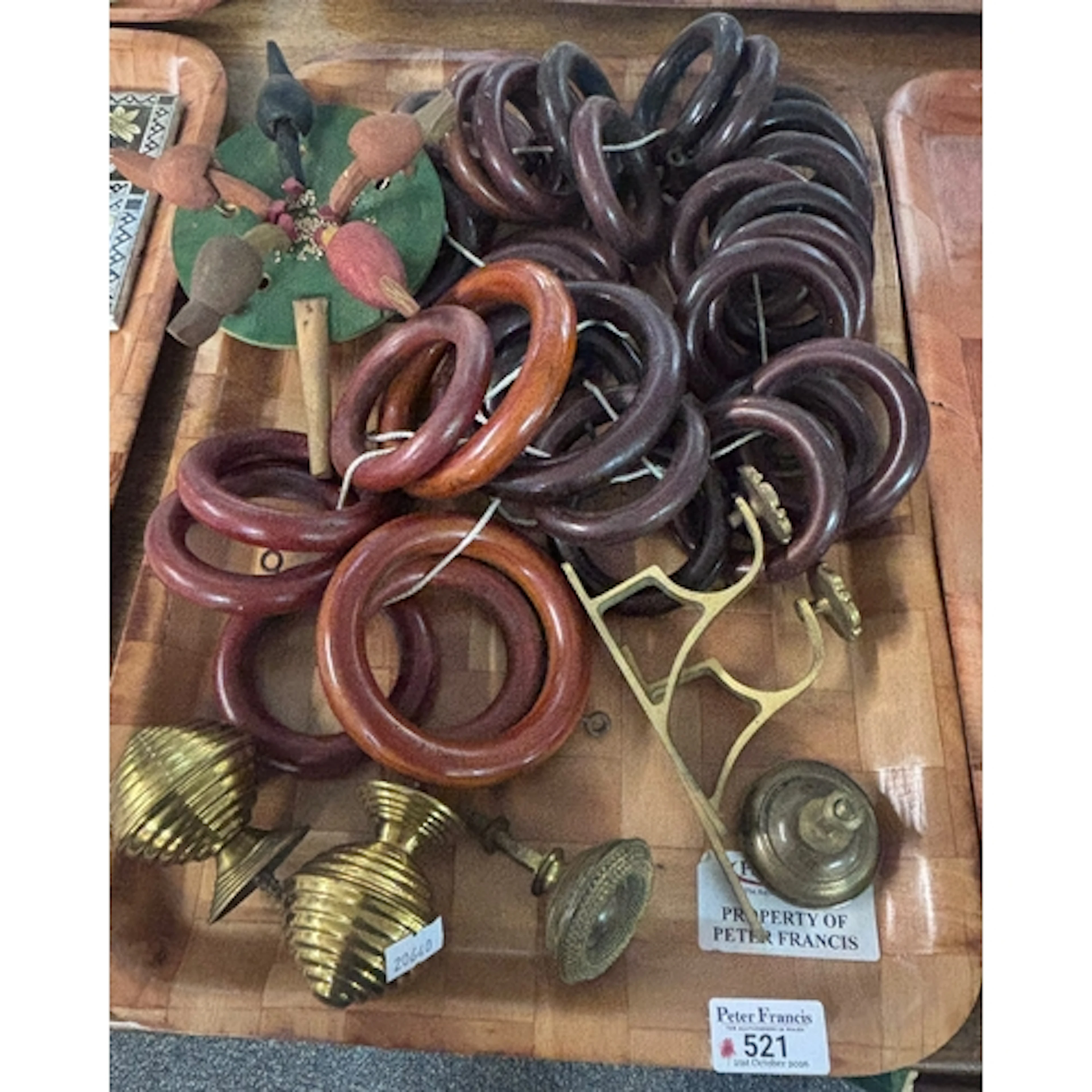 Collection of wooden curtain rings together with brass knob ...
