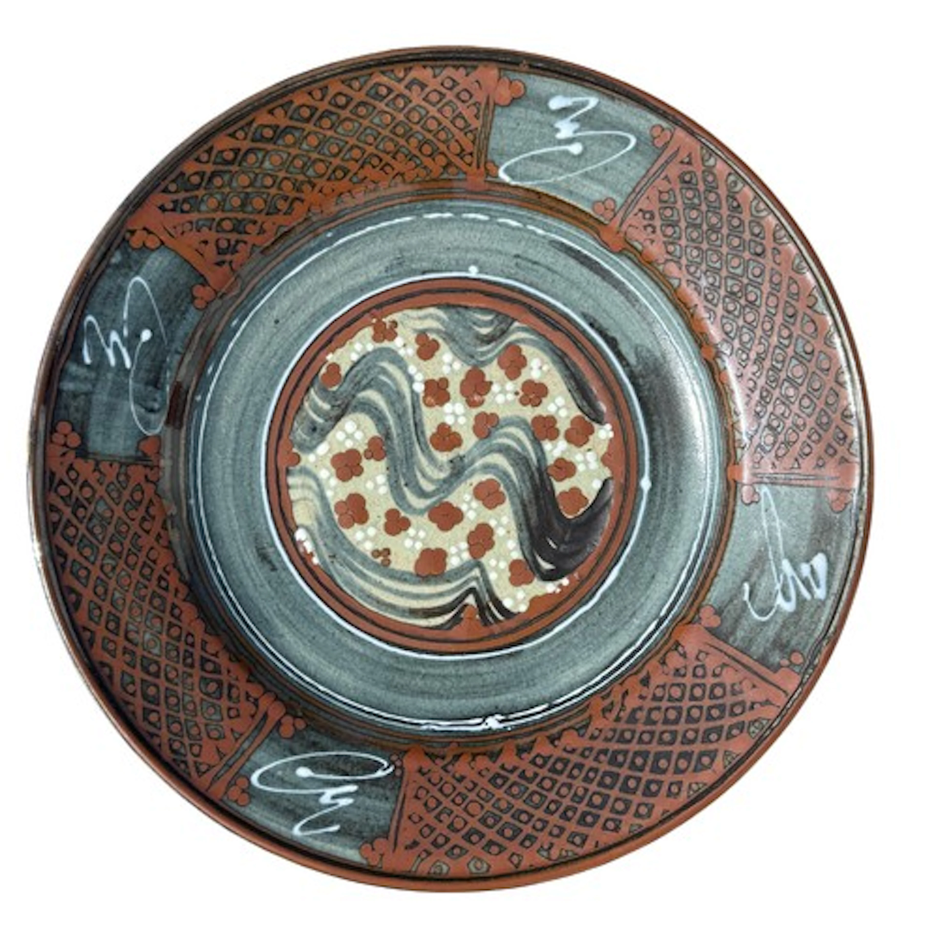 A stoneware charger by David Frith (b.1943) in muted colours...