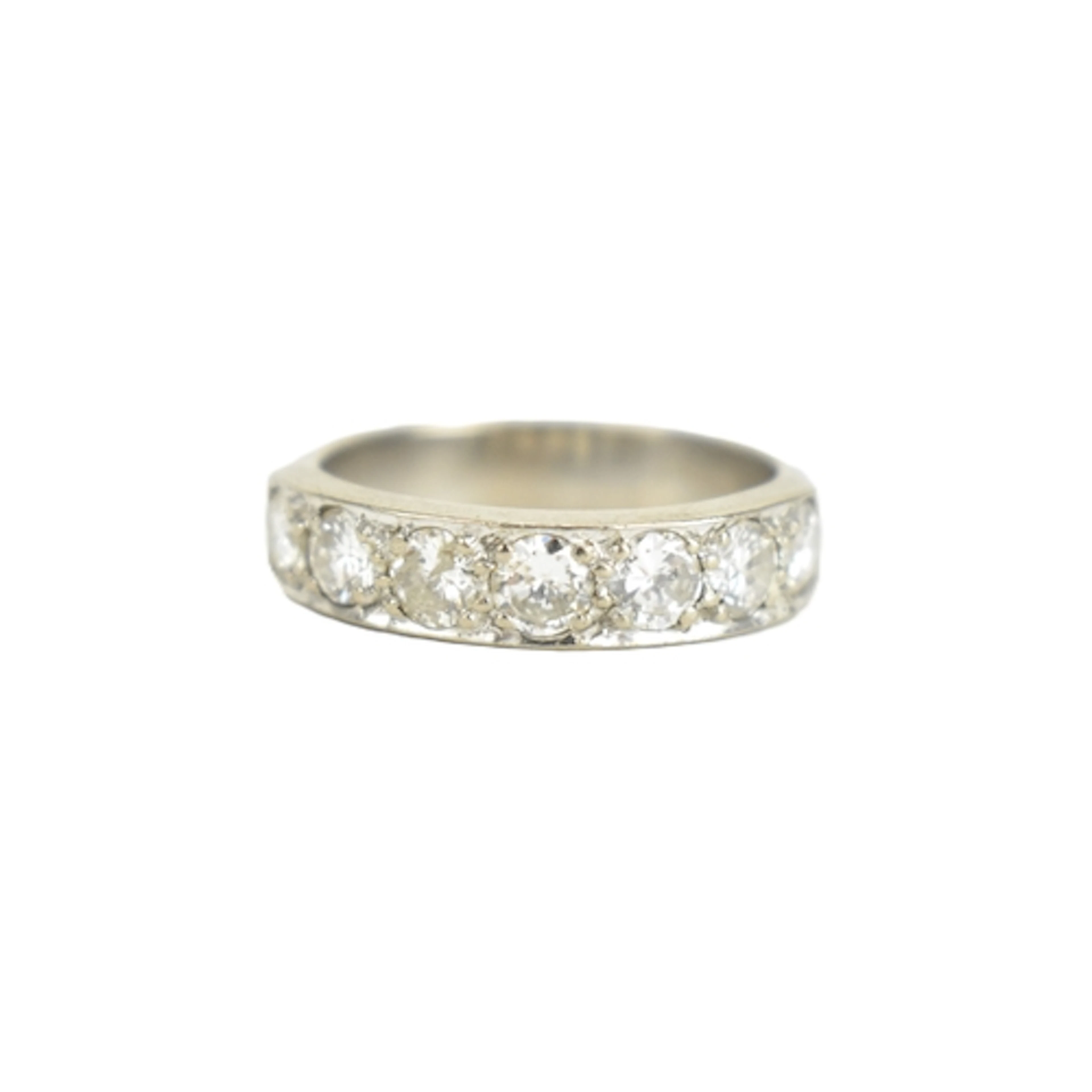 A diamond 18ct white gold half eternity ring, set with seven...