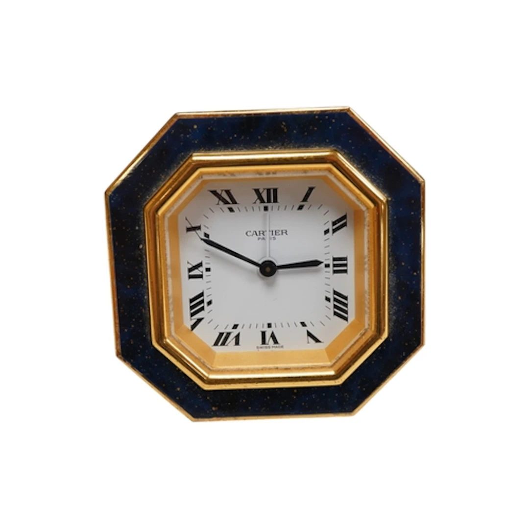 A Cartier octagonal travel clock with lapis enamel border, 7...