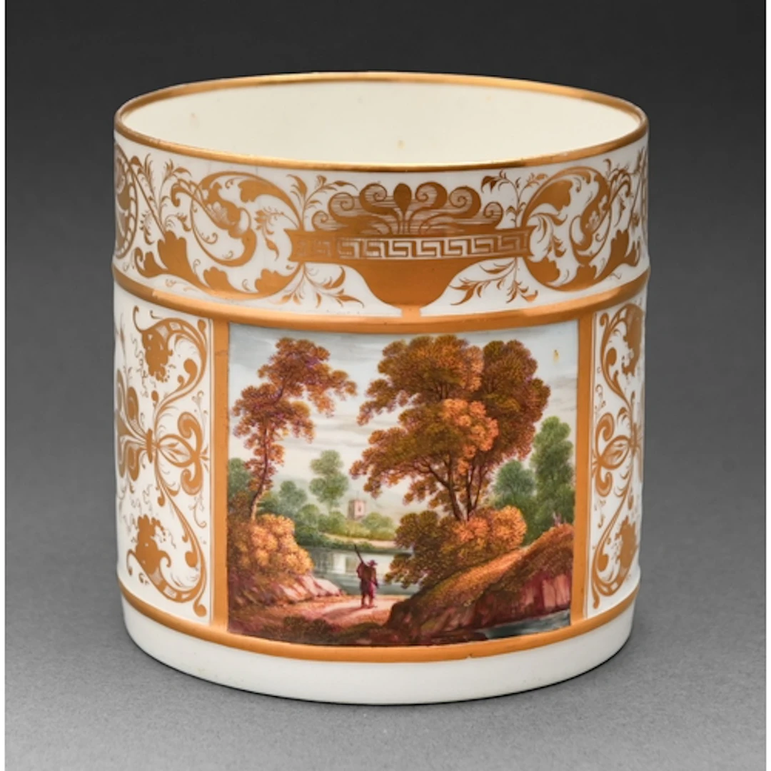 A Derby porter mug, painted with a rectangular wooded landsc...