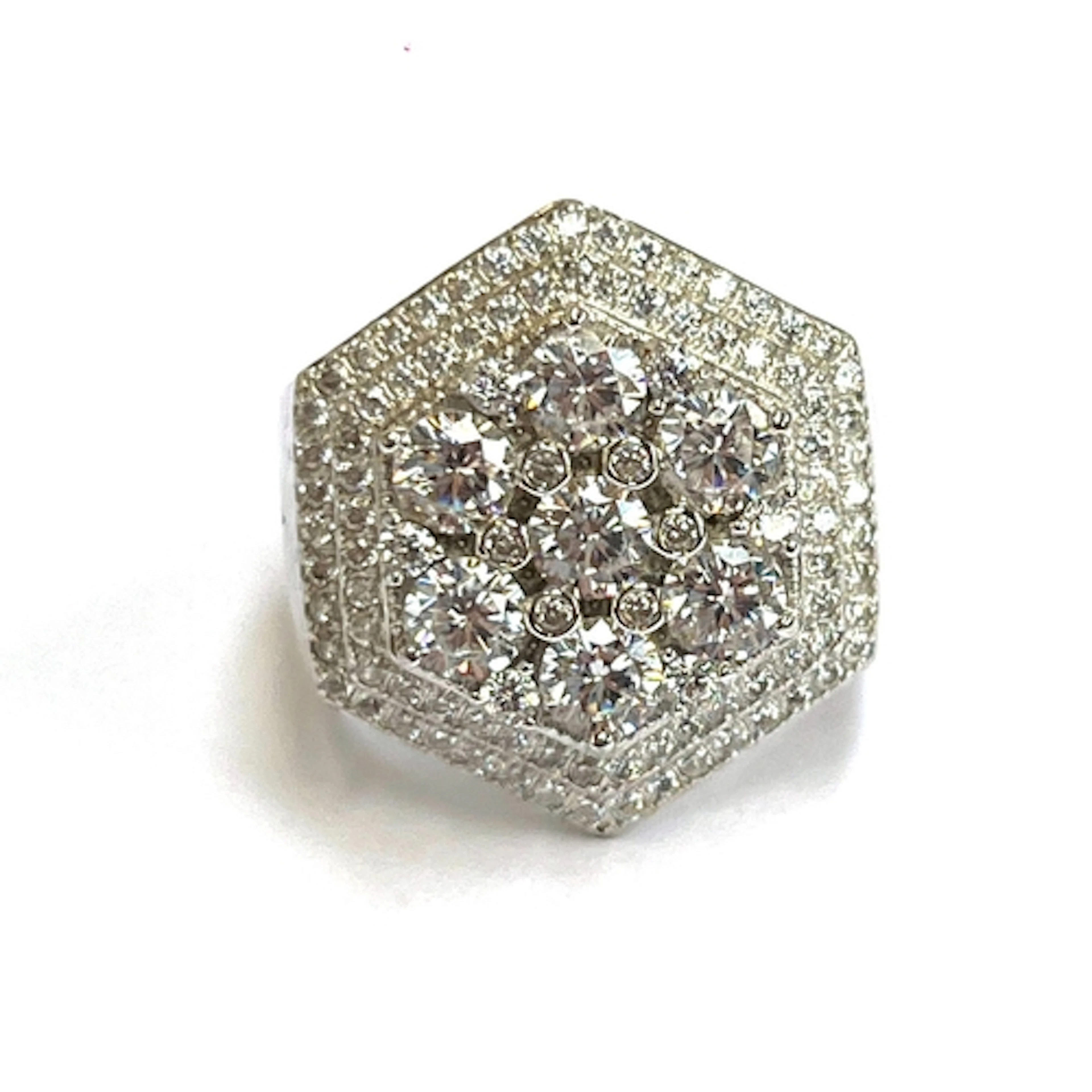 A hexagonal silver ring set entirely with round white cubic ...