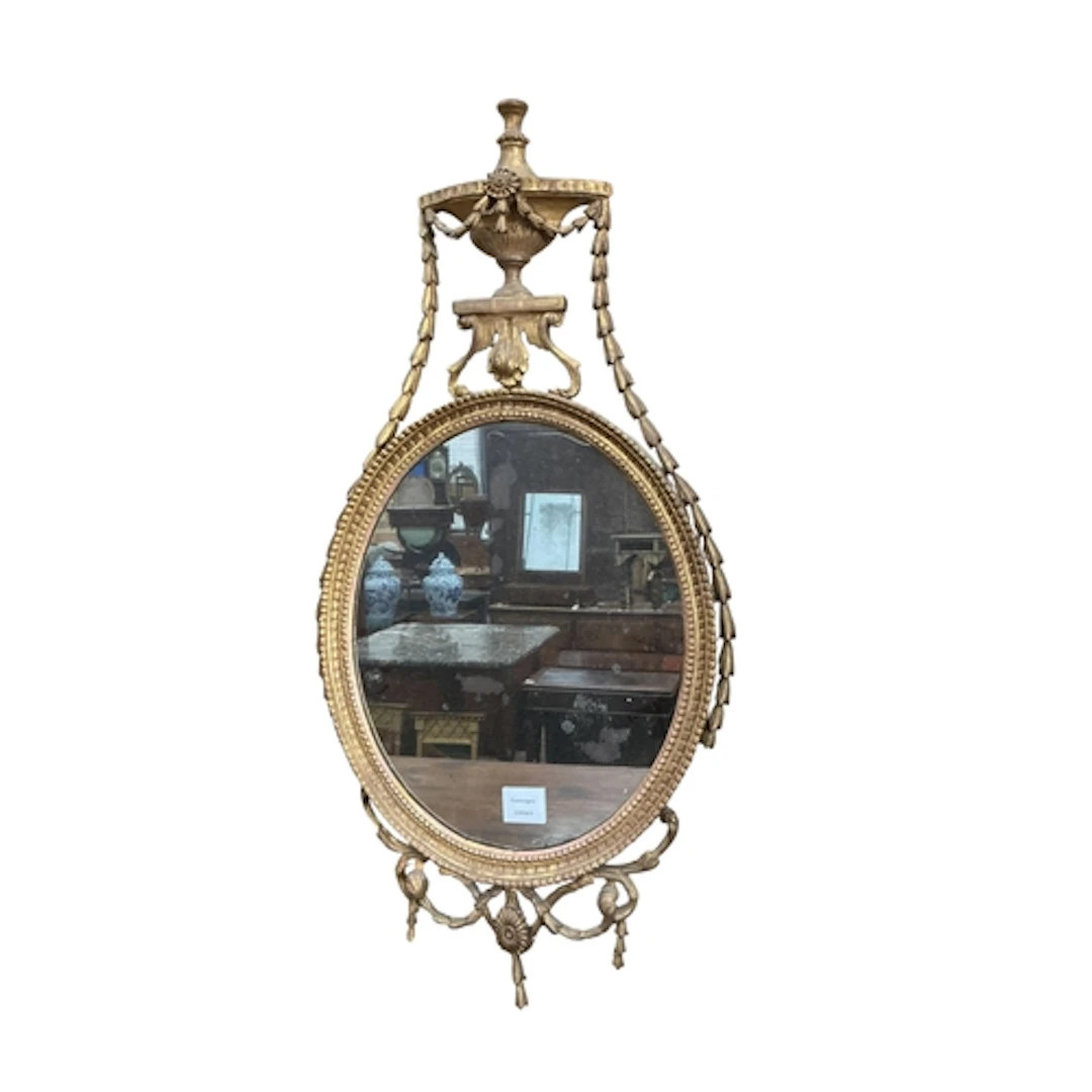 A George III Neoclassical Adam style giltwood oval mirror su...