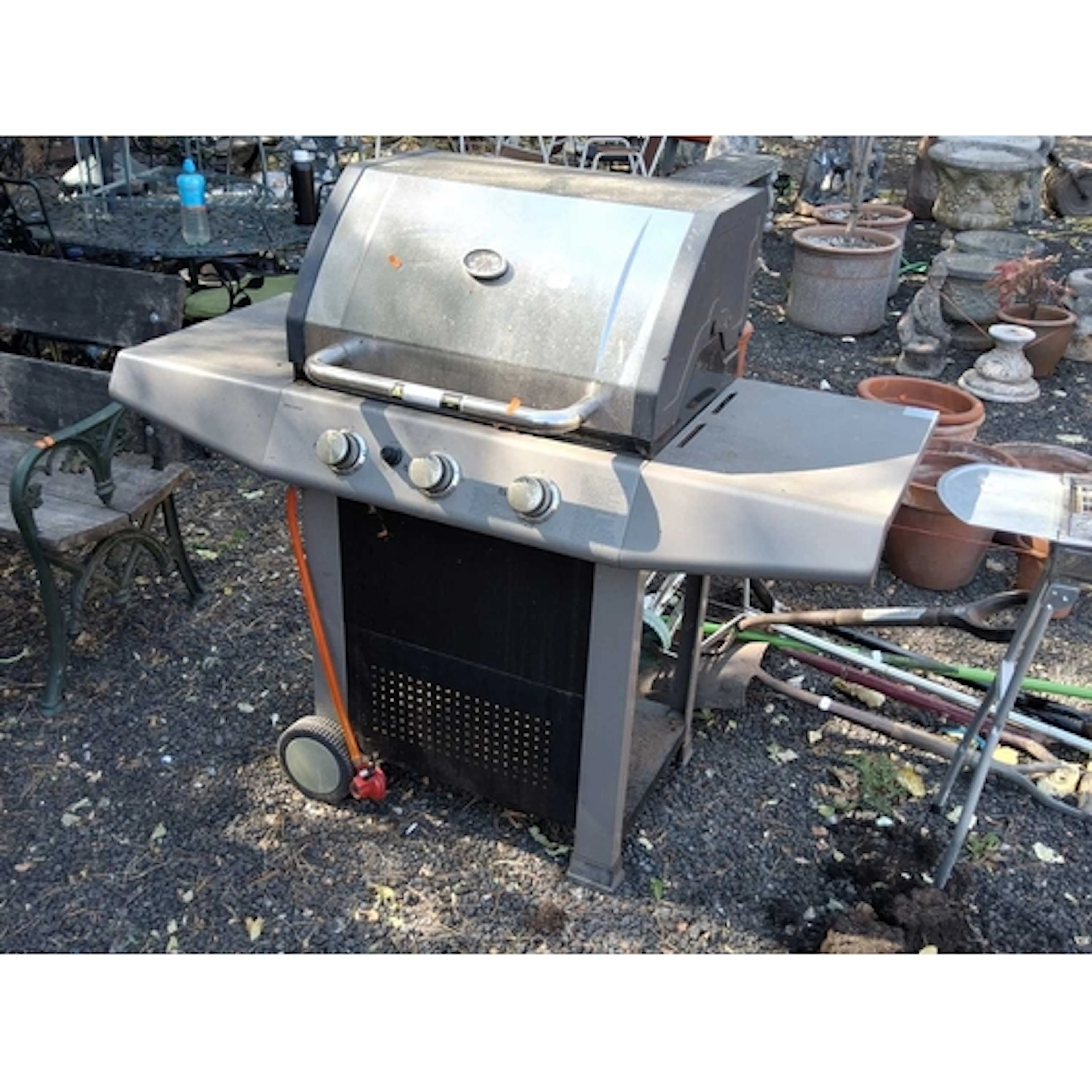 A JOHN LEWIS TRIPLE BURNER GAS BARBEQUE, with side shelves ...
