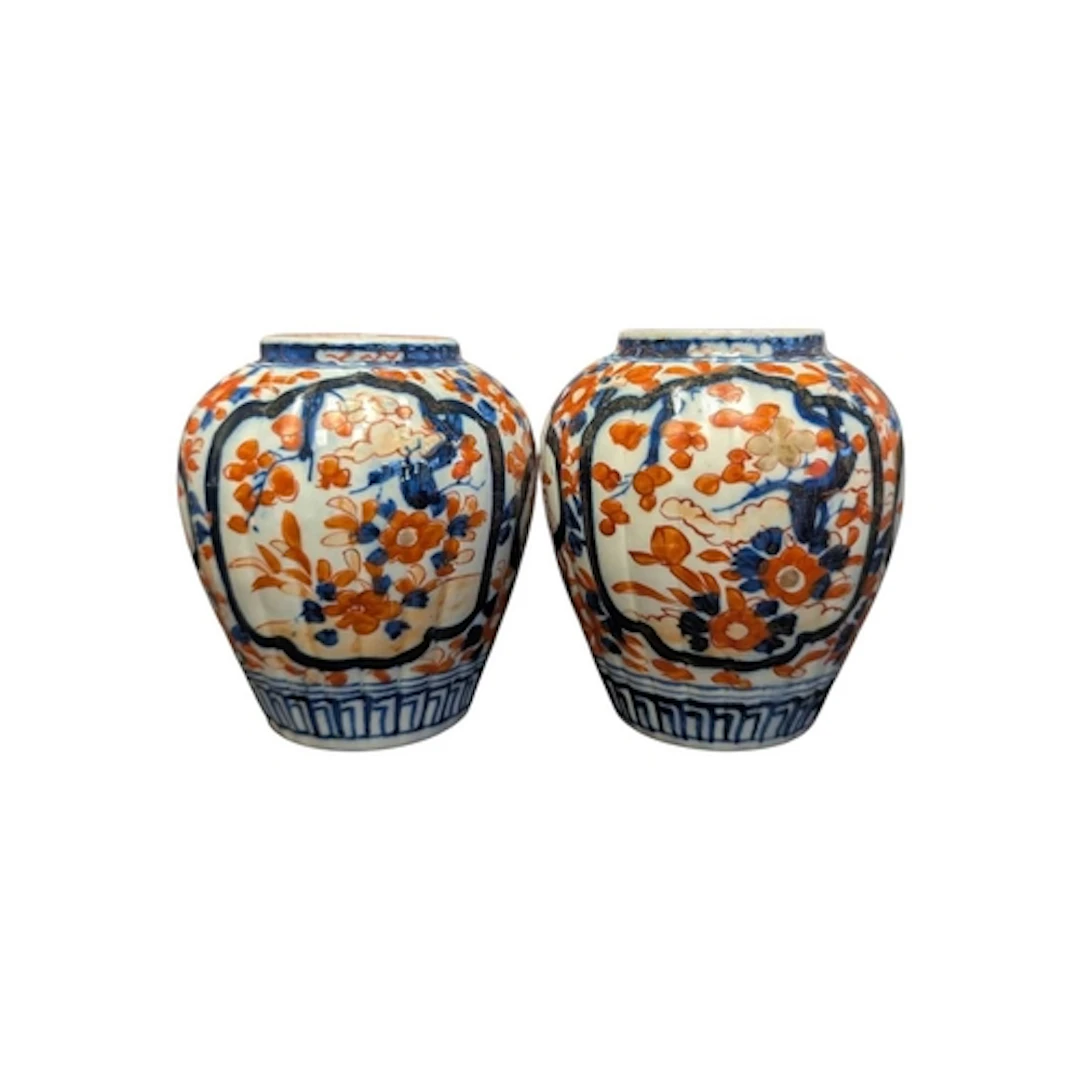 A pair of 19th century Japanese Imari ware bulbous stub vase...