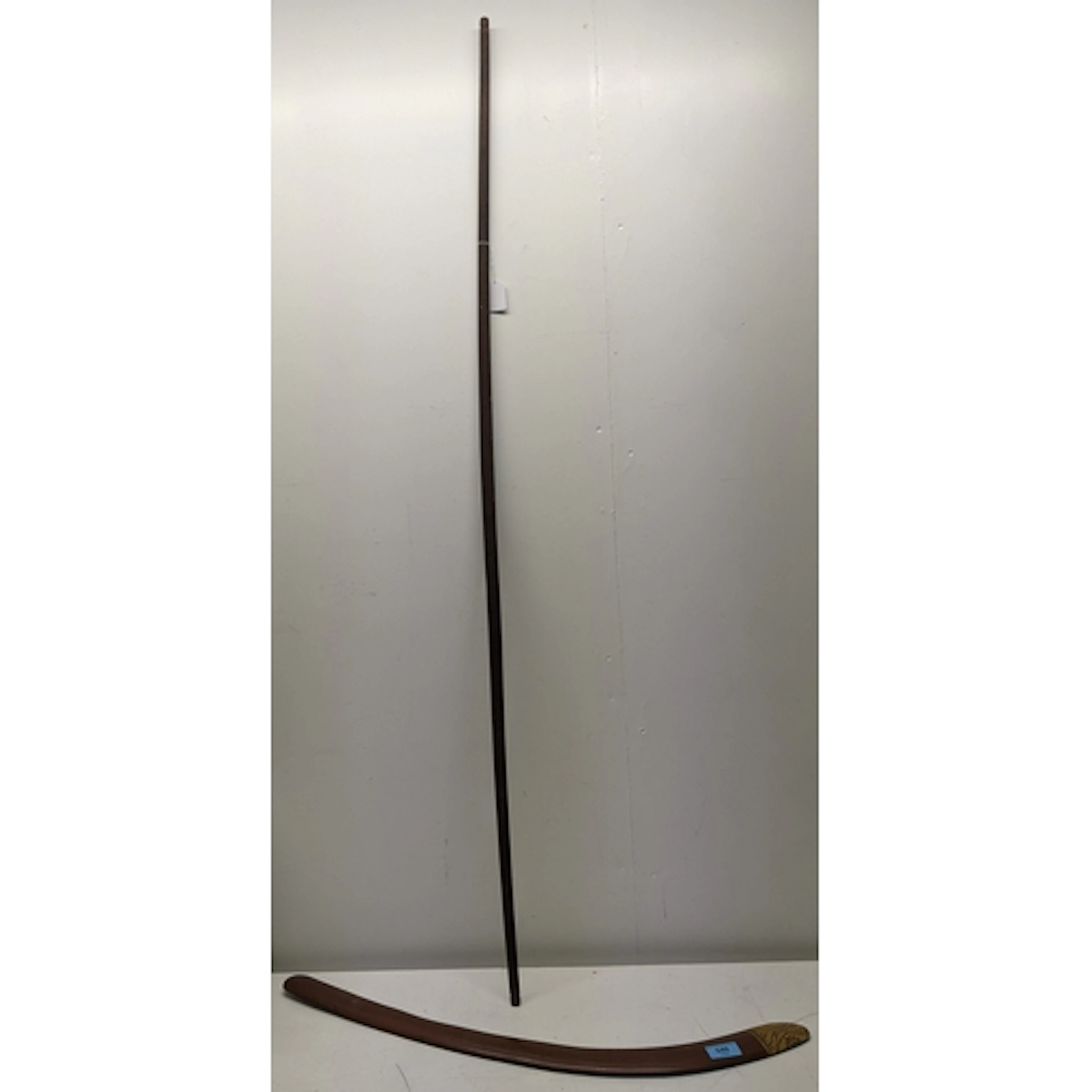 A traditional aboriginal wooden boomerang with painted decor...