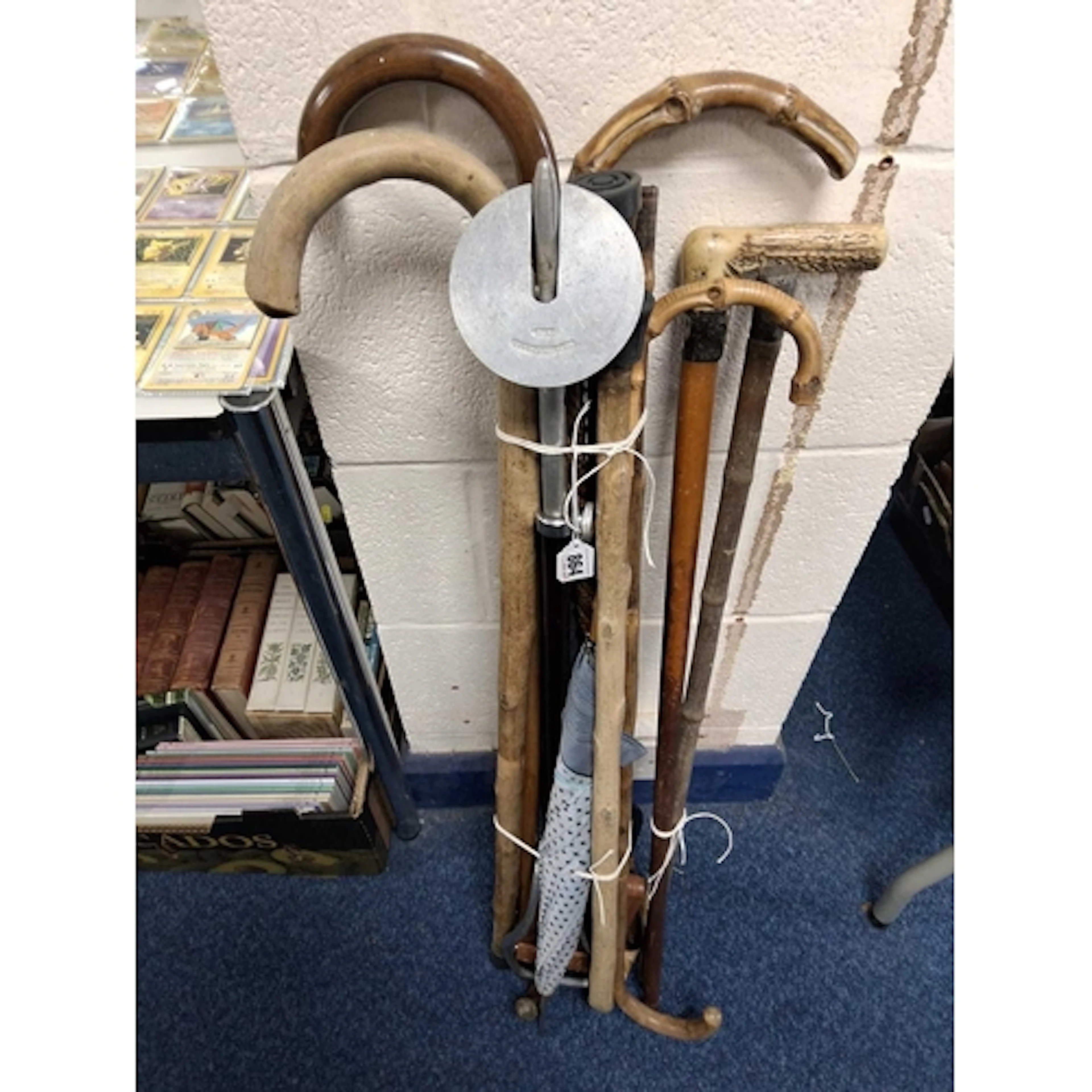 A GROUP OF VINTAGE WALKING STICKS to include a hallmarked si...