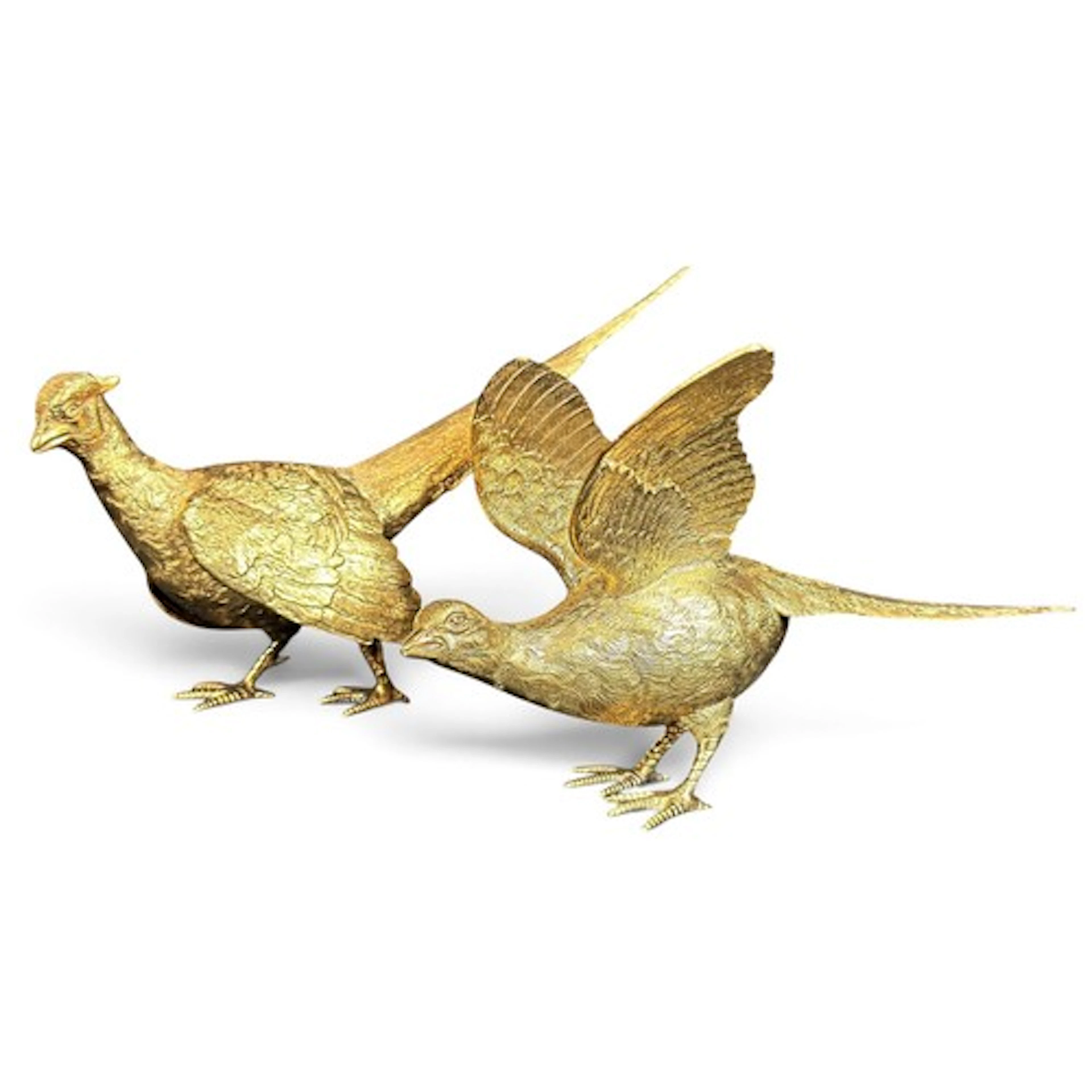 A heavy pair of silver-gilt models, a pheasant and hen pheas...