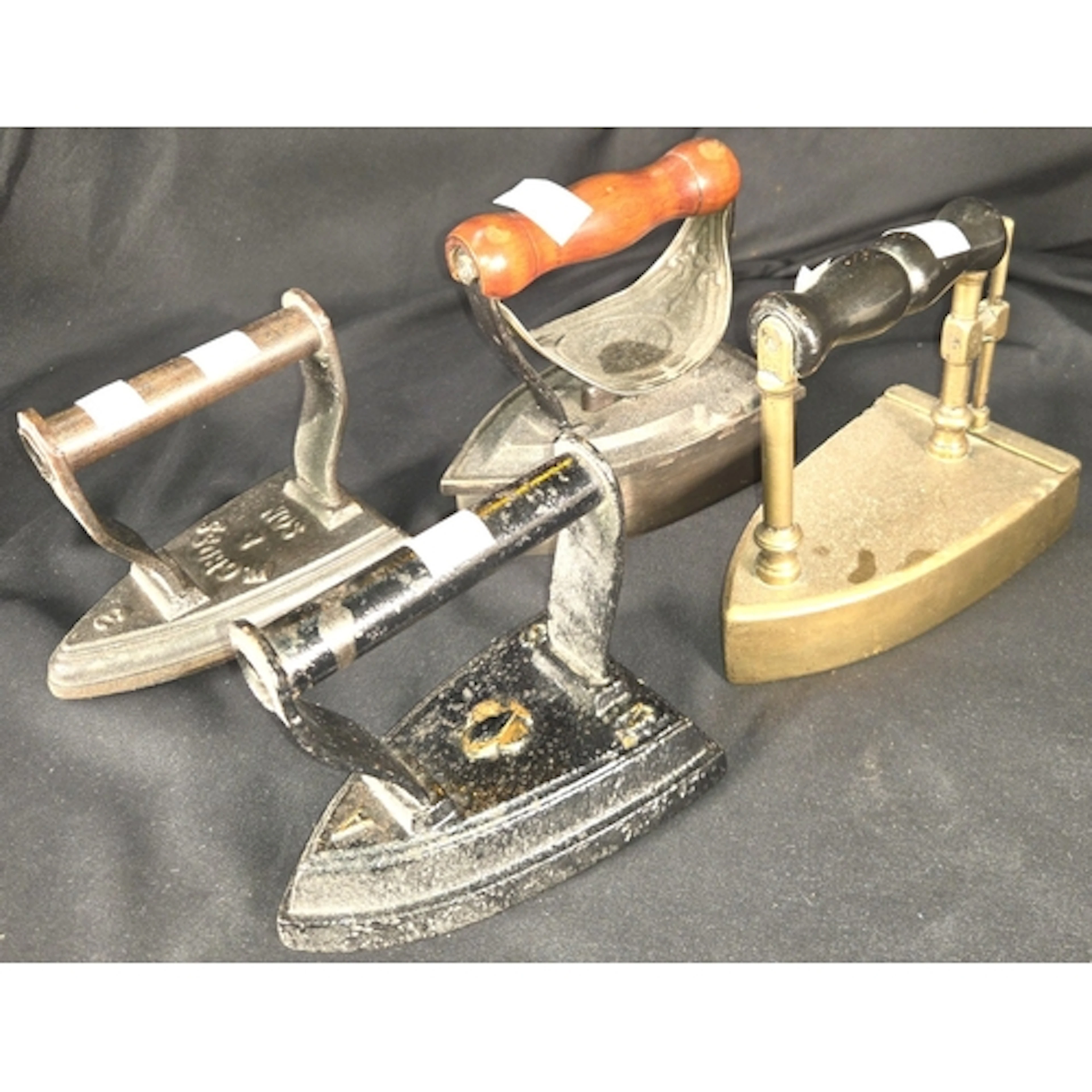 A Victorian brass Sad iron. A Victorian boxed J & J Sidd...