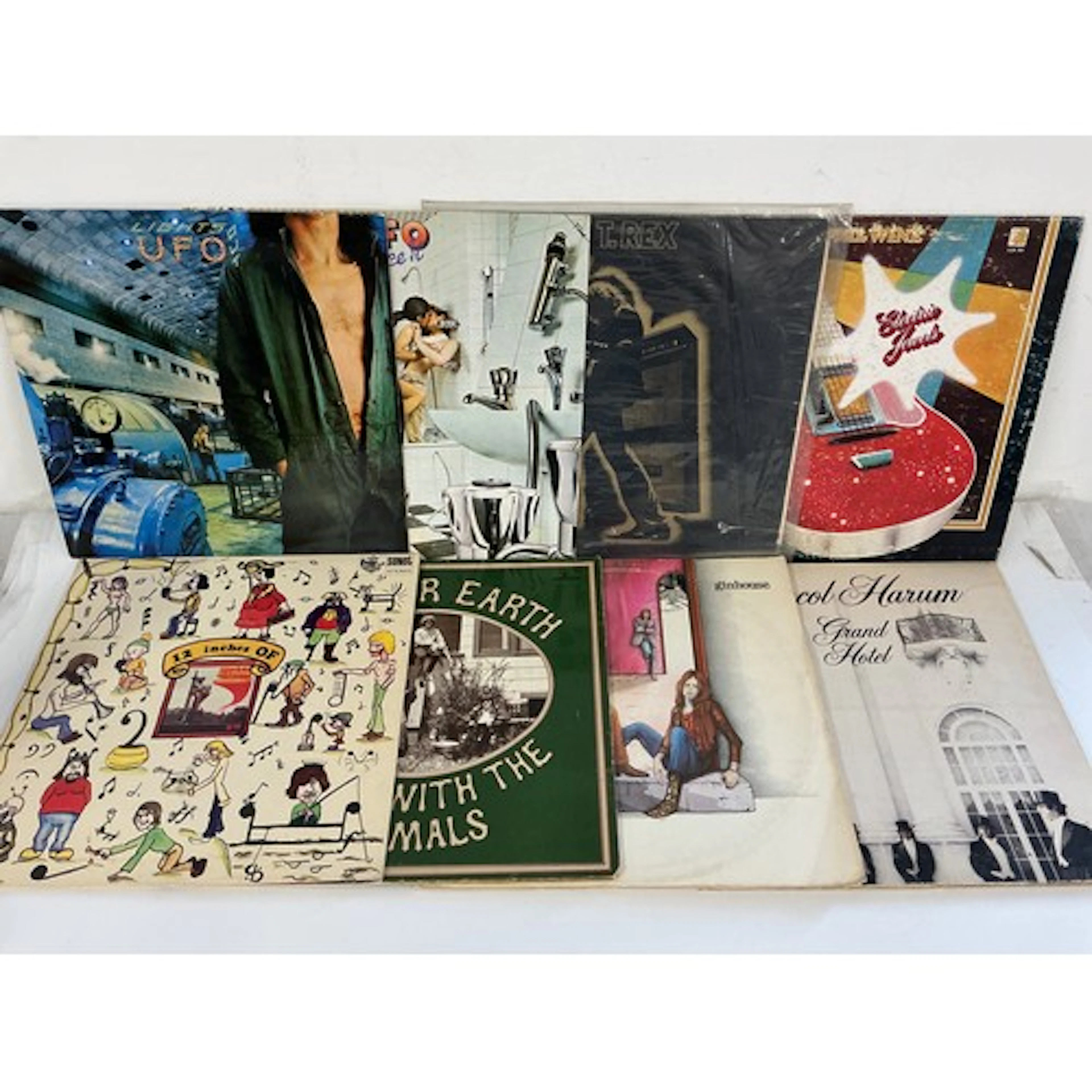 Two bags containing 16 rock LPs by various artists including...