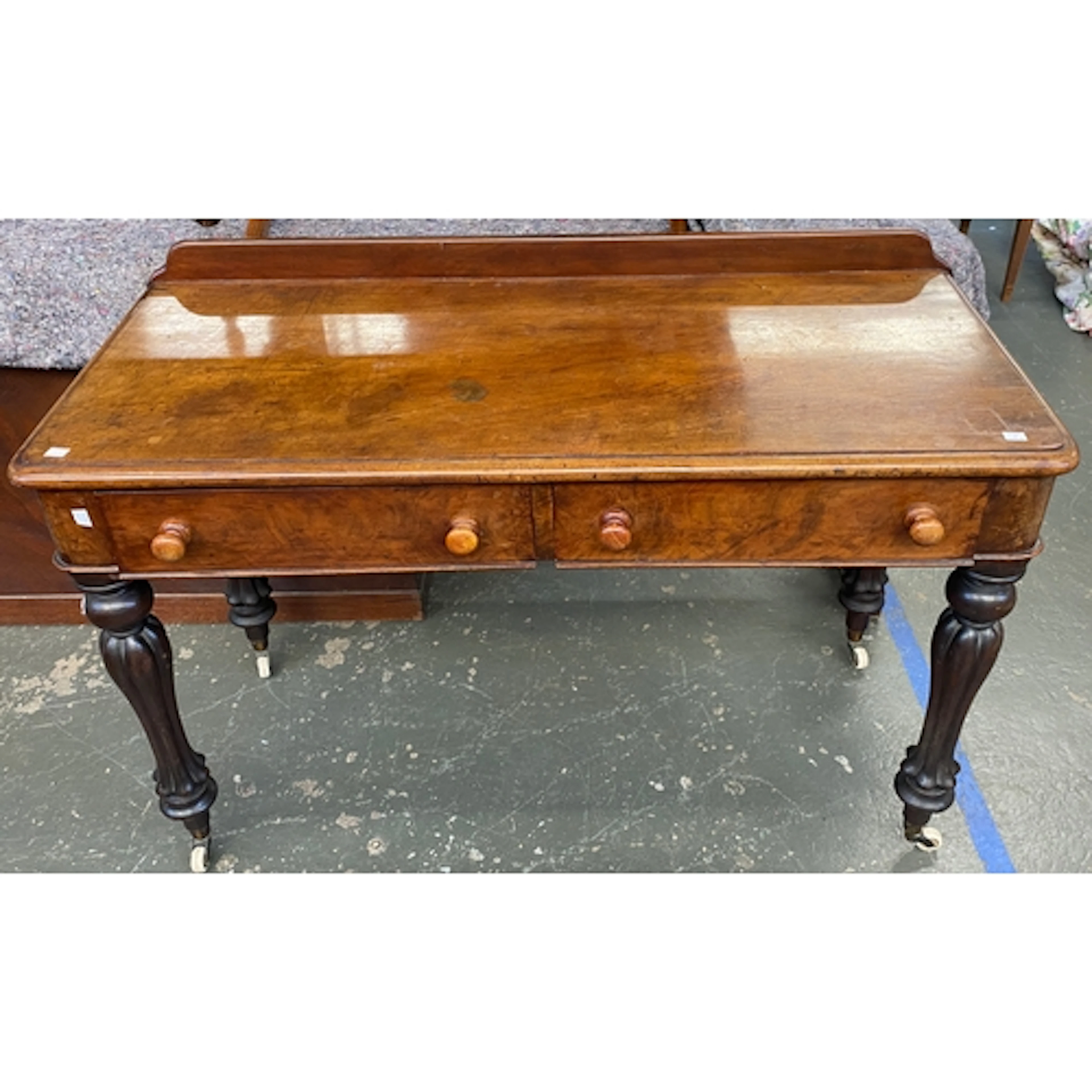 A Victorian mahogany side table, two frieze drawers on carve...