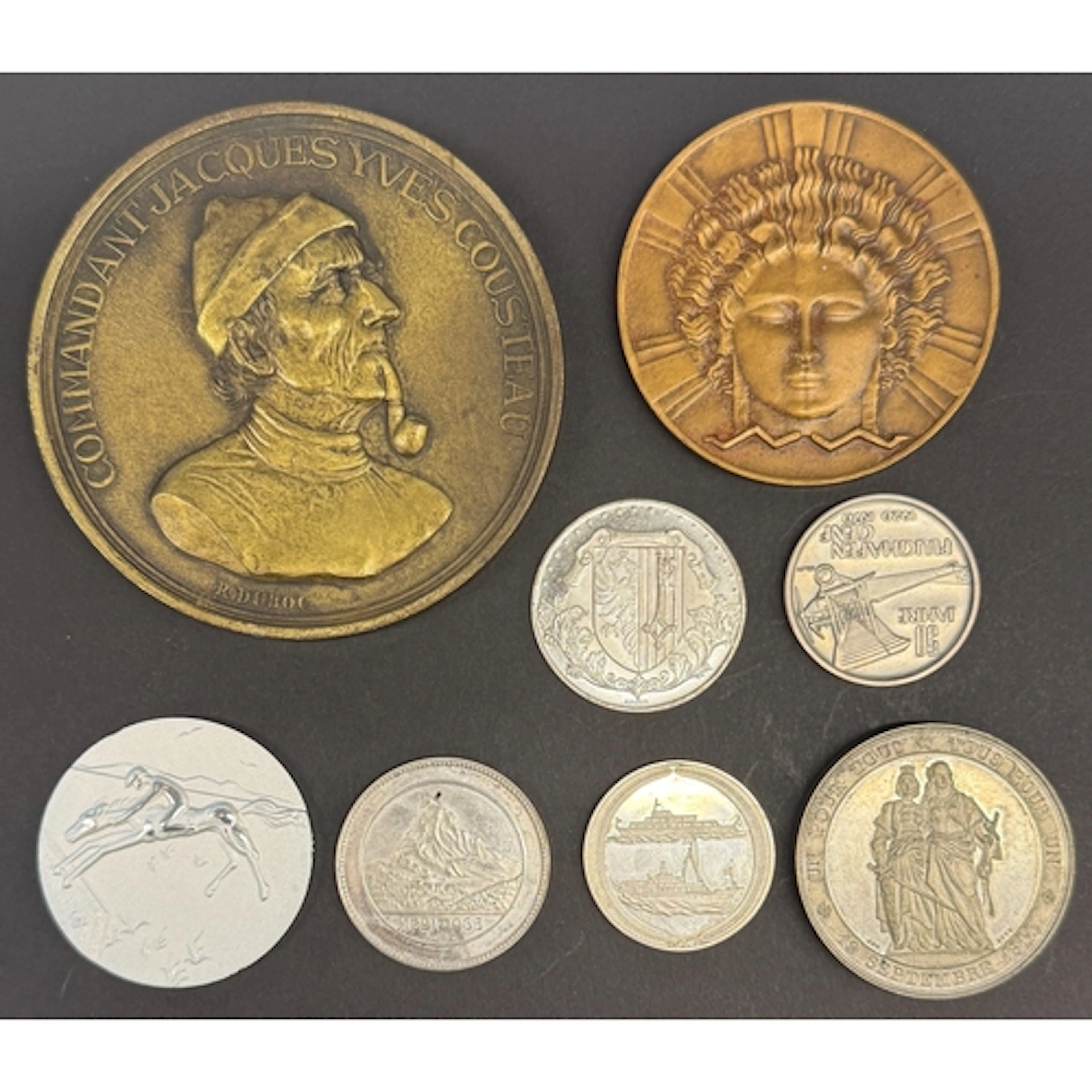 A group of eight World commemorative medals and medallions, ...