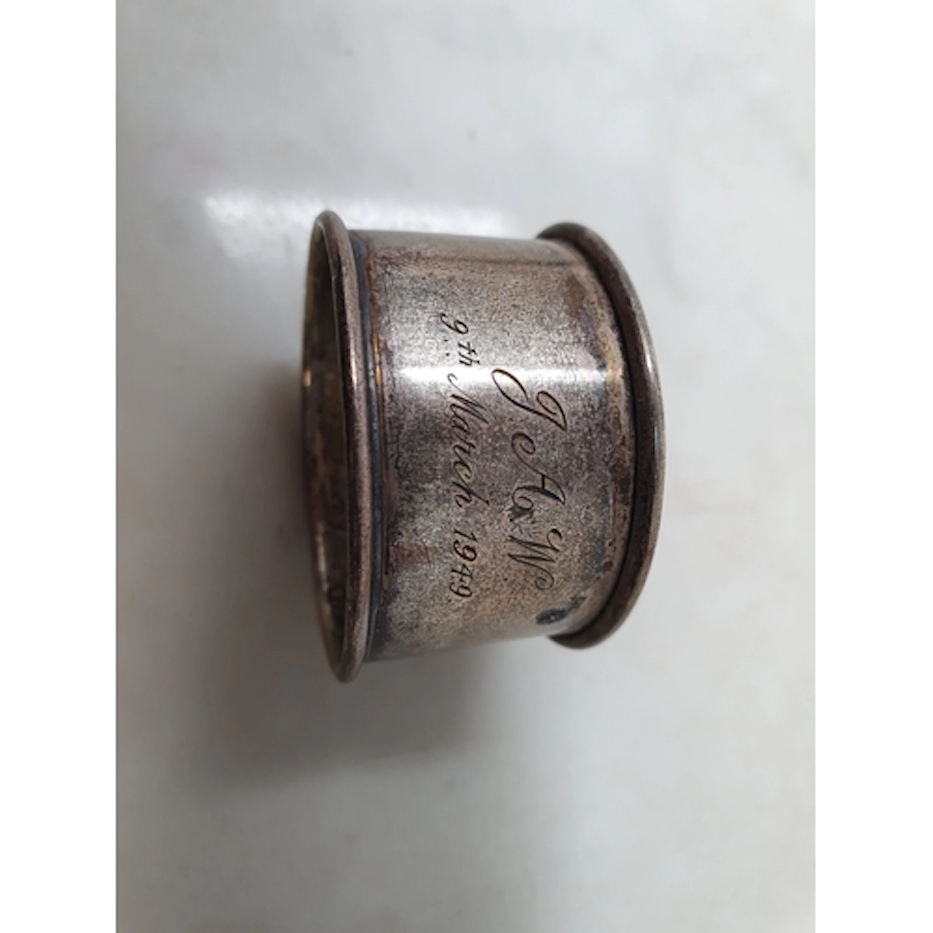 A silver circular Napkin Ring, plated Spoons and other cutle...