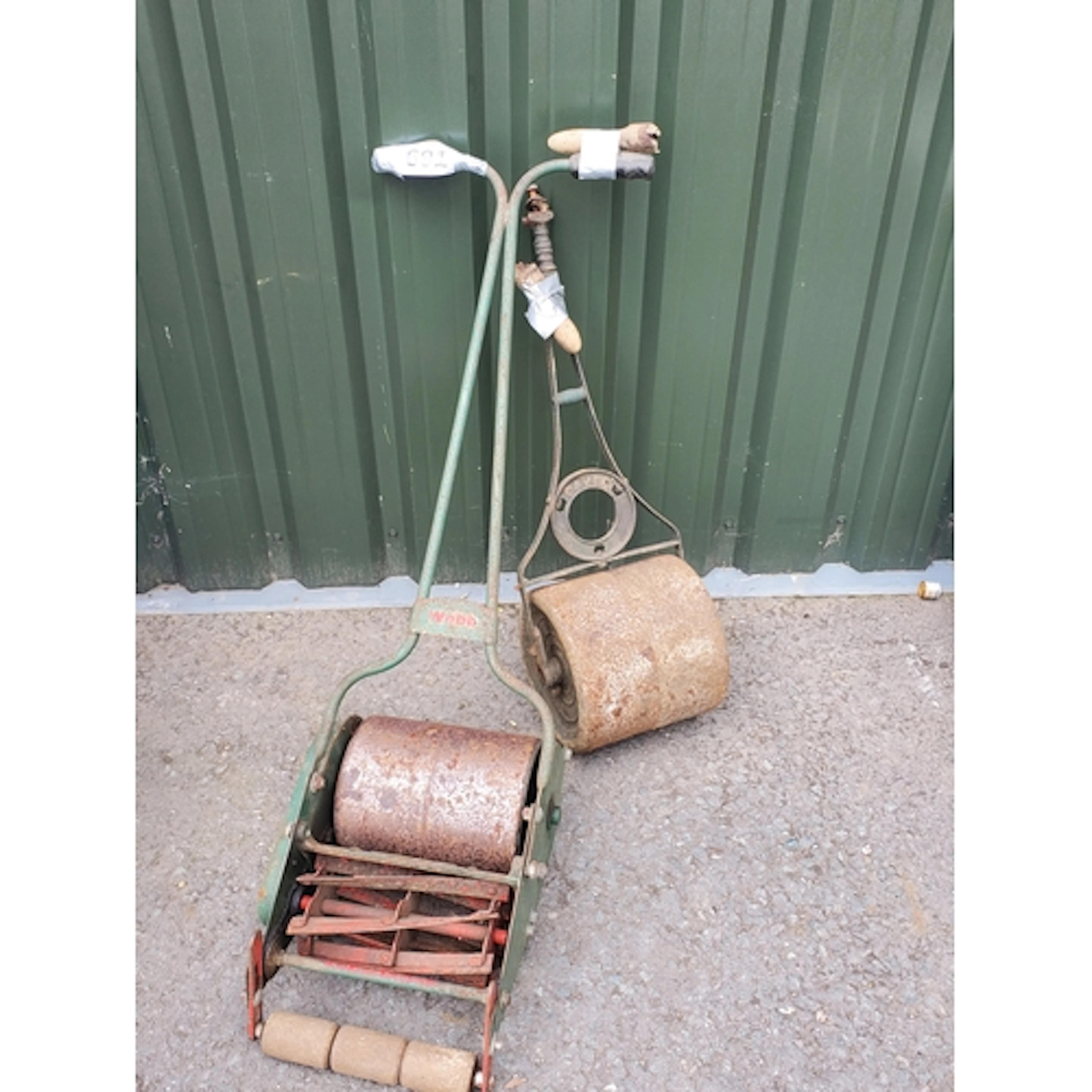 A push along Lawn Mower and Garden Roll