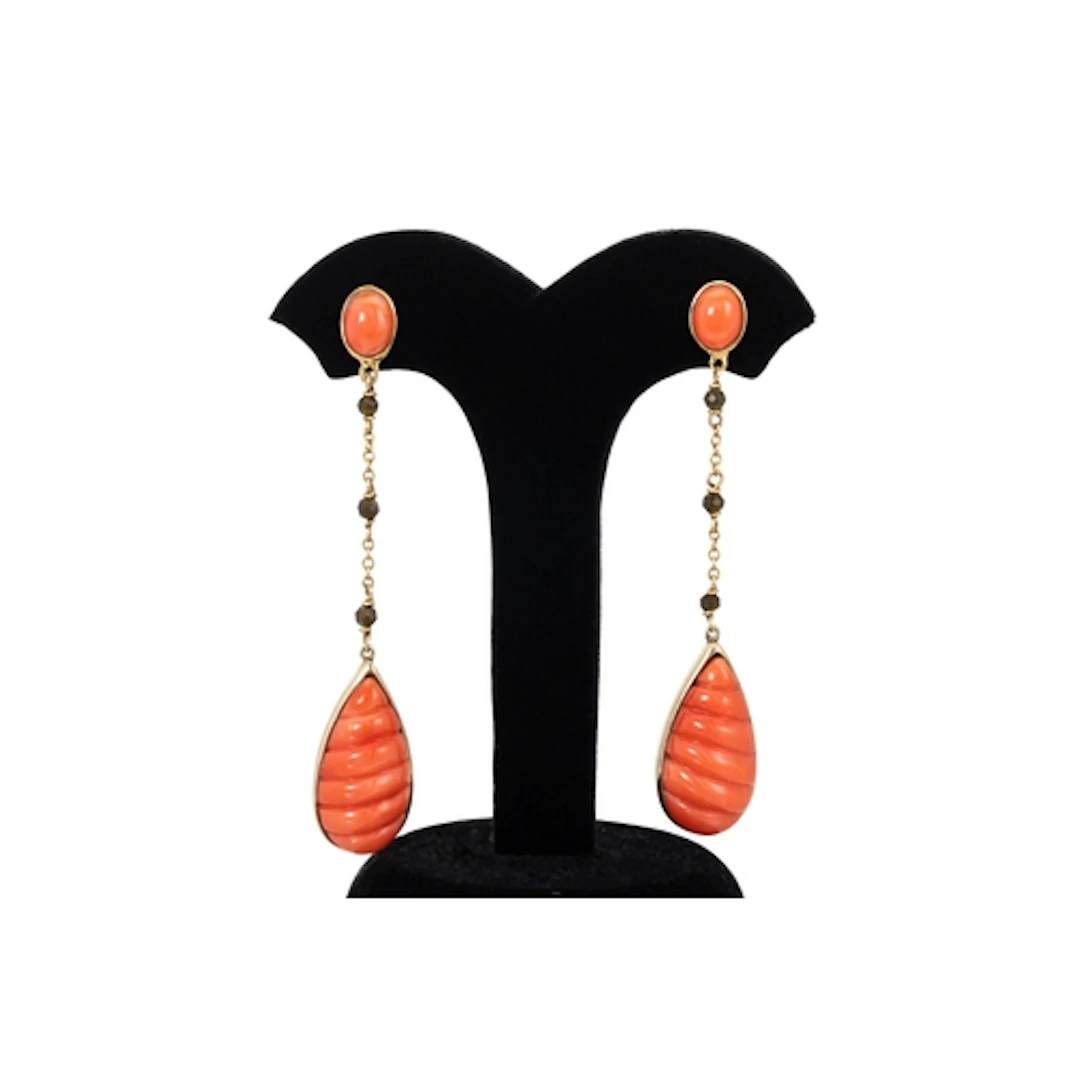 A PAIR OF CORAL DROP EARRINGS, the carved coral drops suspen...