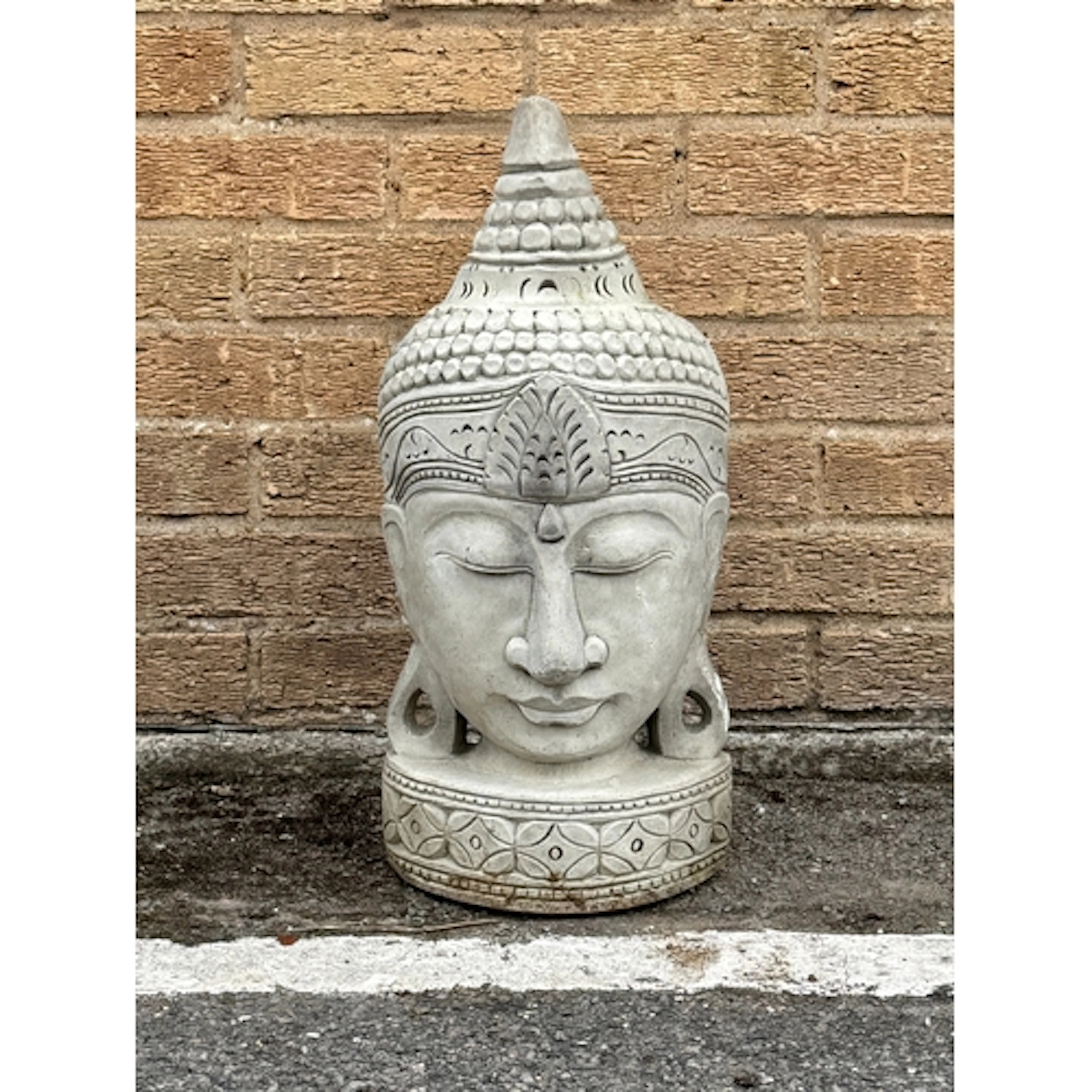 A reconstituted stone Buddha head sculpture - 55cm high, 26c...