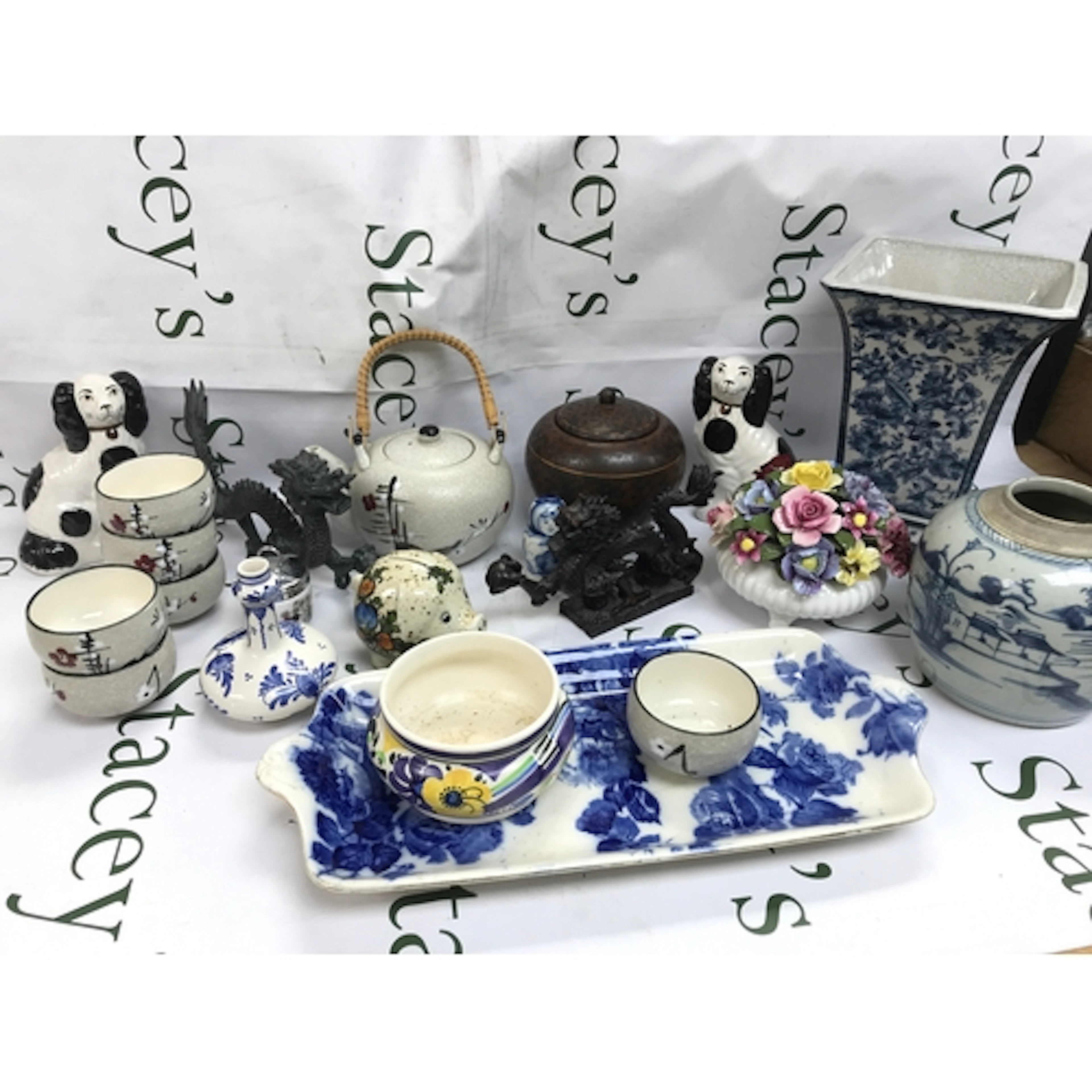 A collection of ceramics including dragon figures, vases, te...