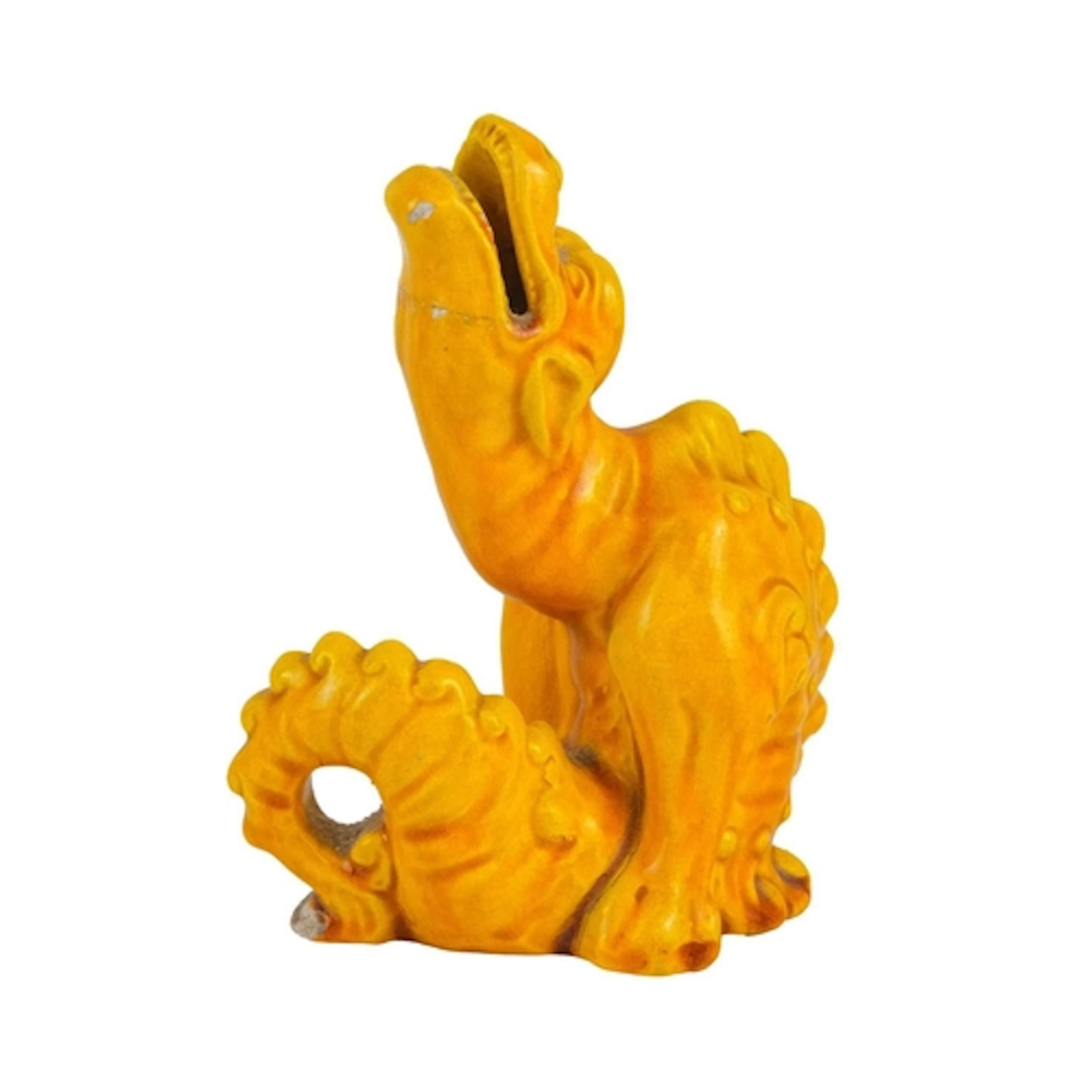 A Burmantofts grotesque pottery dragon figure. Yellow glazed...