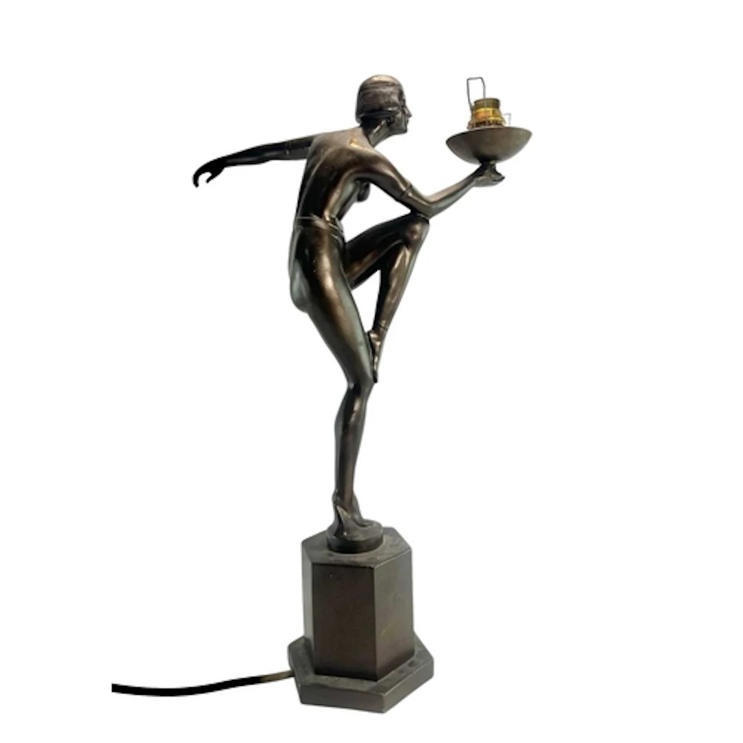 A 20th century Art Deco-style bronzed figural desk or table ...