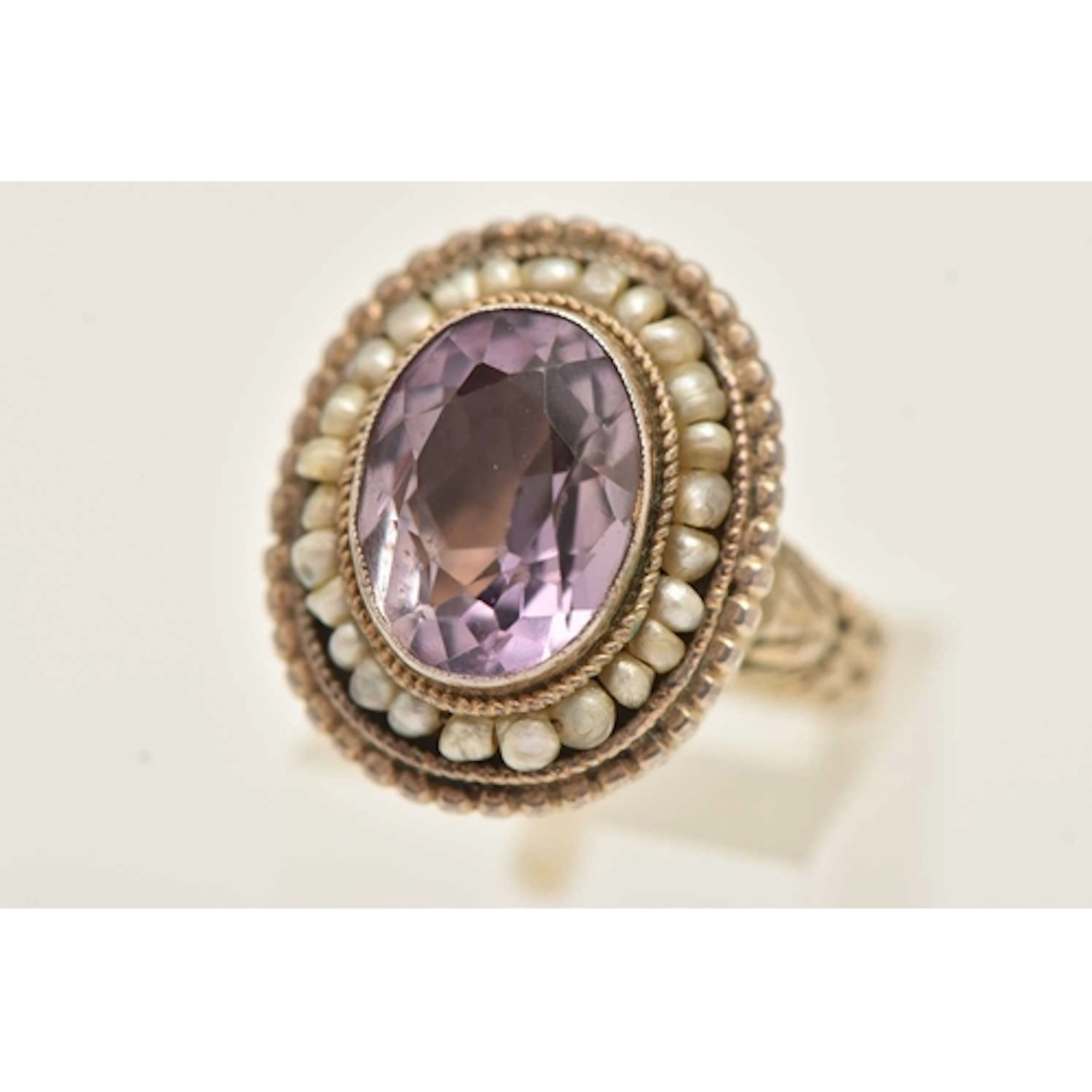 An early to mid 20th cetury amethyst and seed pearl poison r...