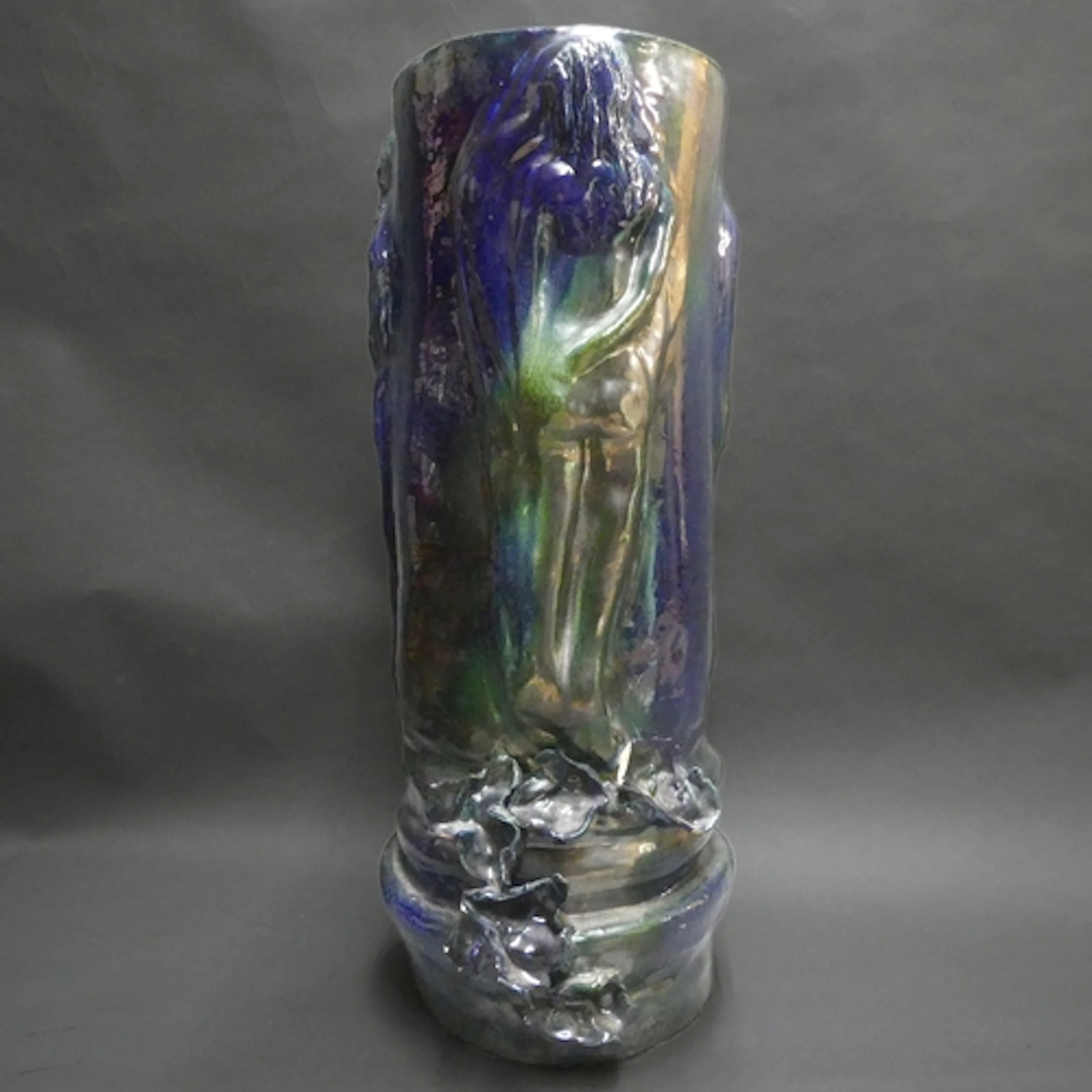 A large and unusual green to blue glazed pottery stick stand...