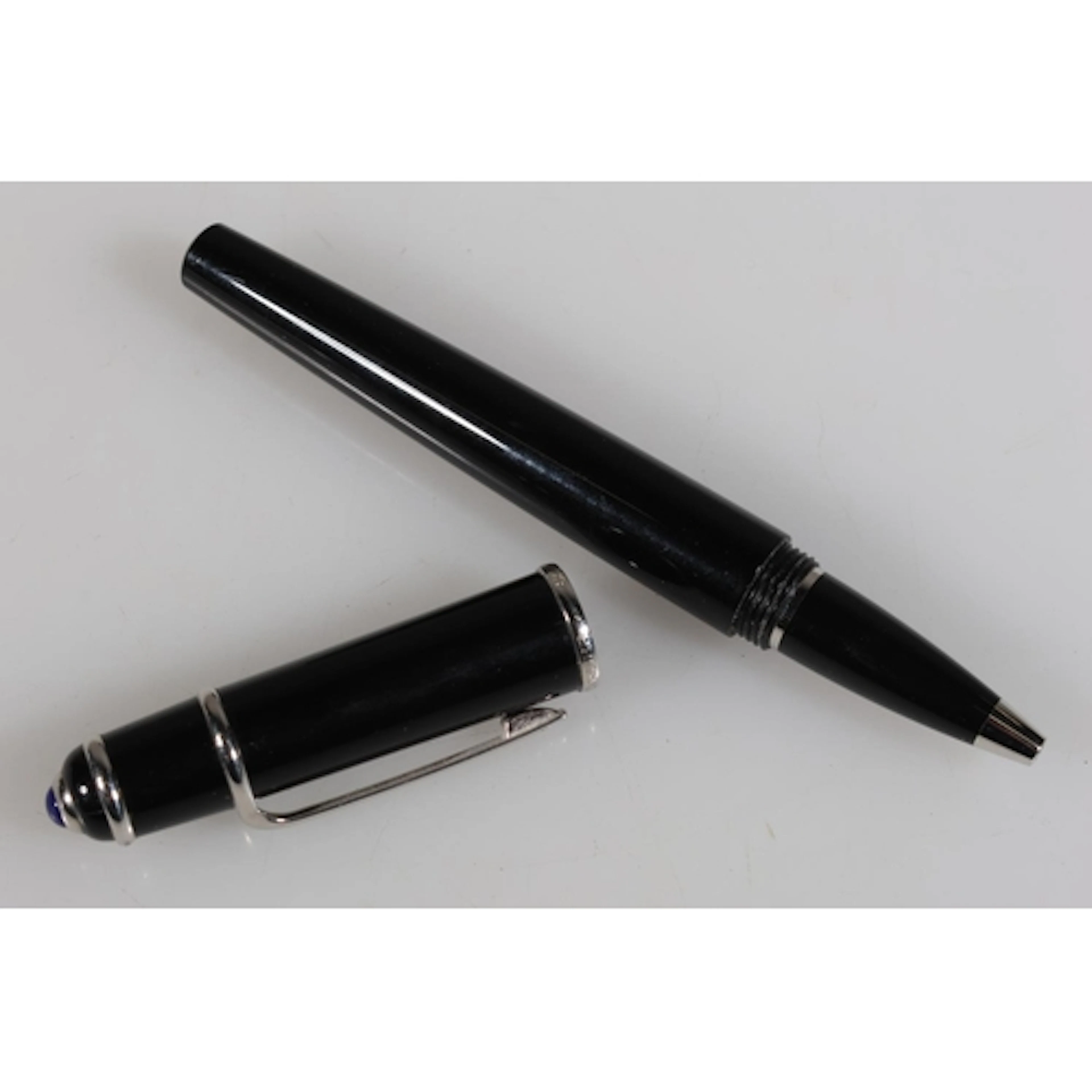 Vintage pen marked 'CARTIER'.