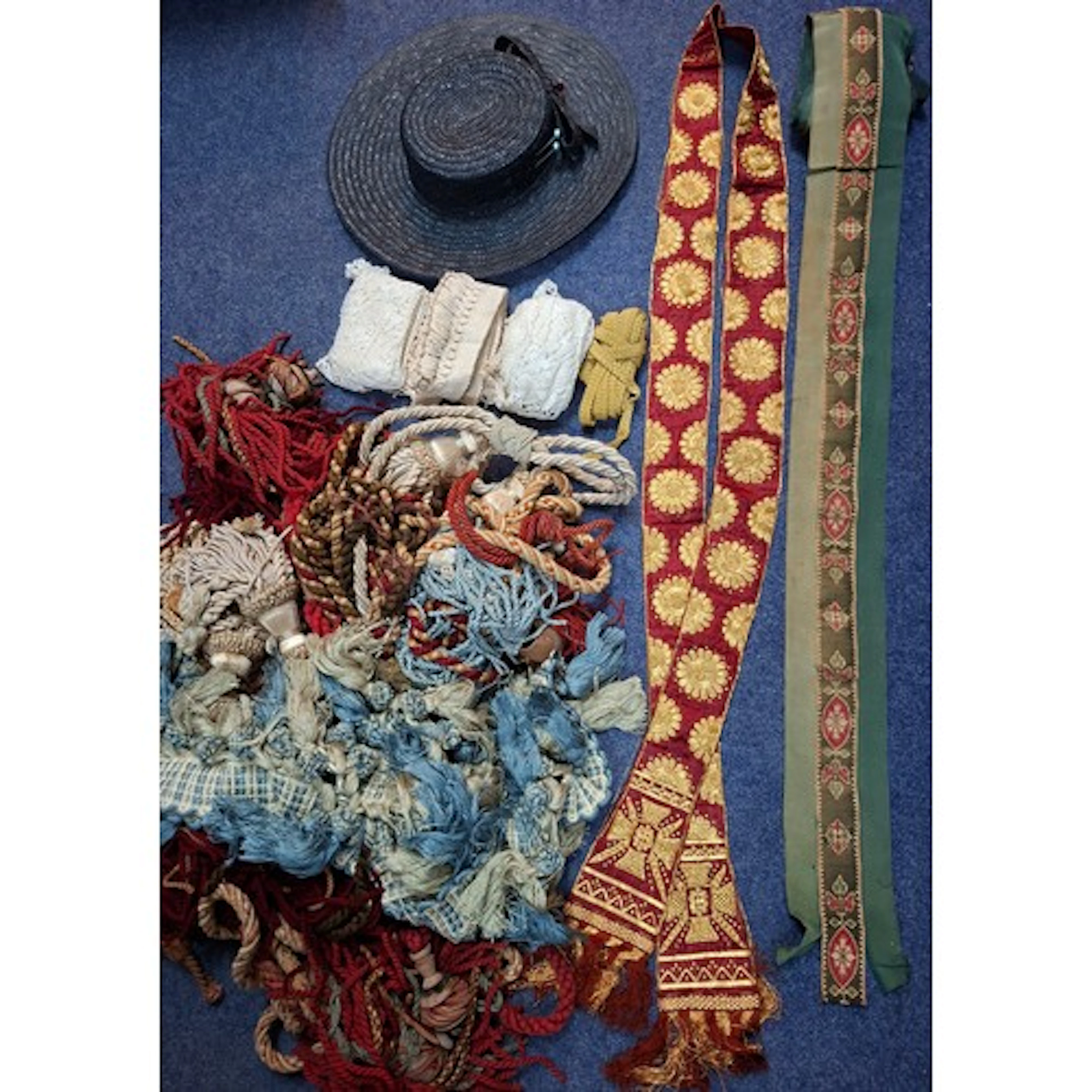 A red silk and gold thread ecclesiastical sash with ornate e...