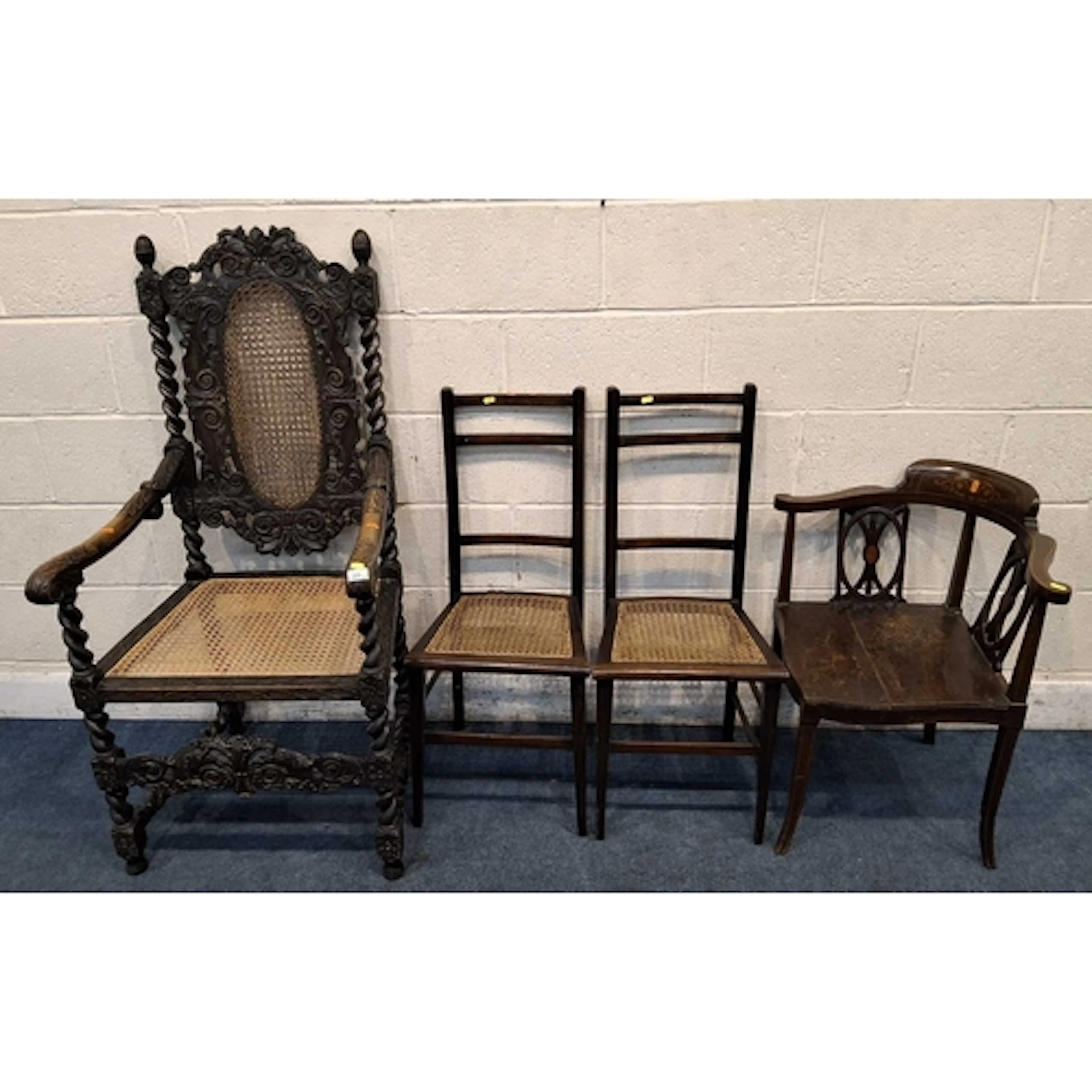 AN EARLY 20TH CENTURY OAK ARMCHAIR, with cane back and seat,...