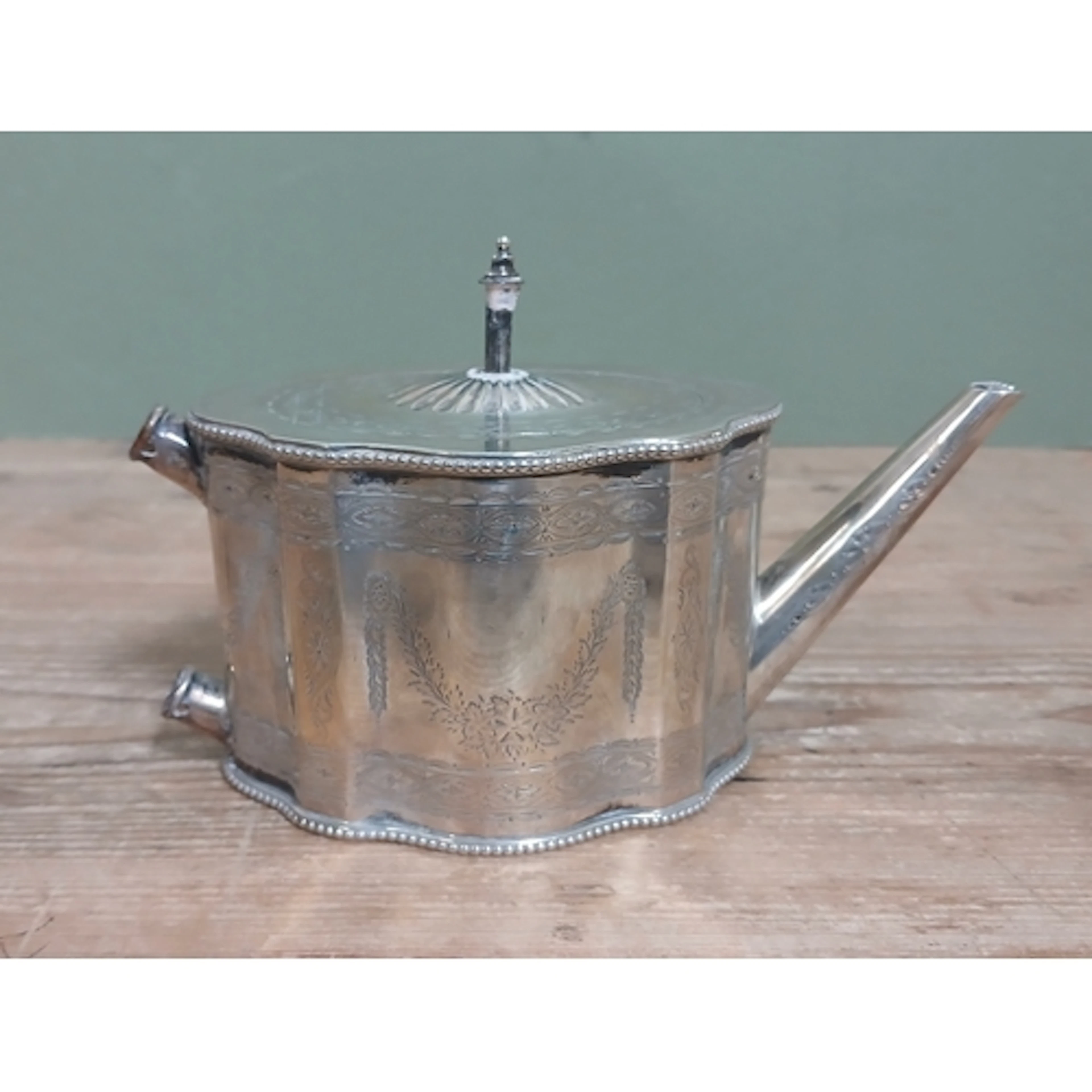 A Victorian bright cut engraved silver tea pot, Robert Harpe...