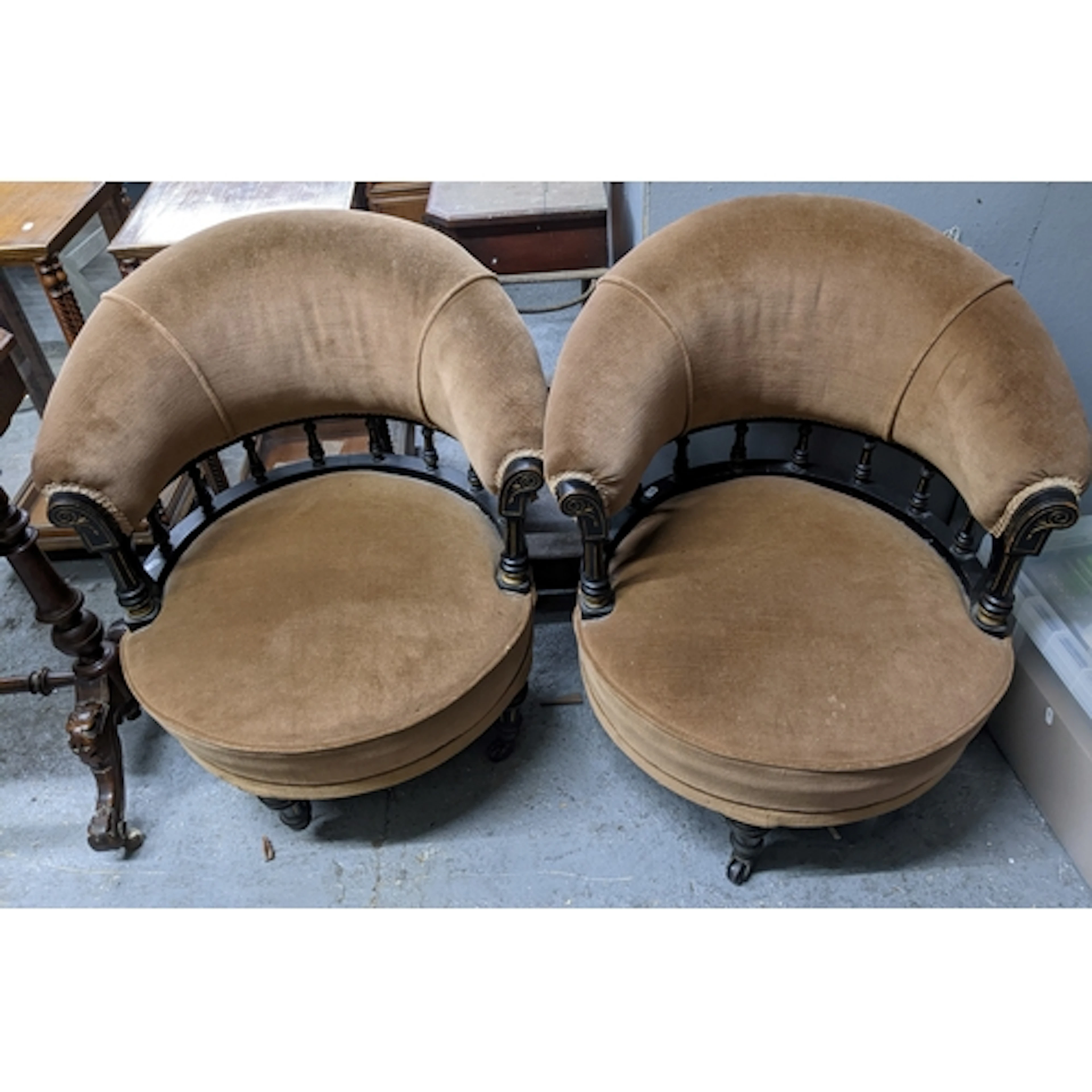 A pair of Victorian aesthetic period tub chairs, ebonized wo...