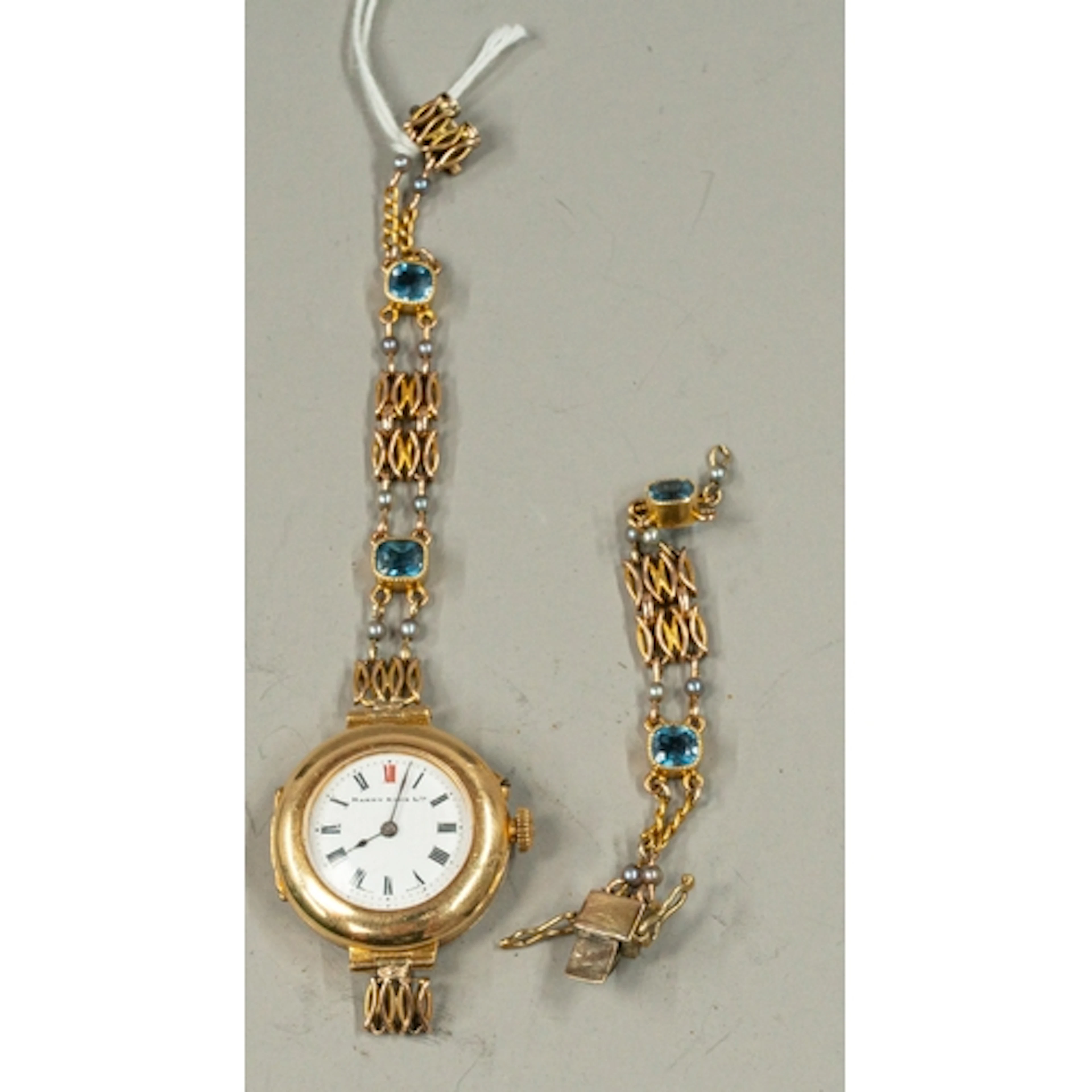 Watches: an 18ct yellow gold cased trench style watch, the e...